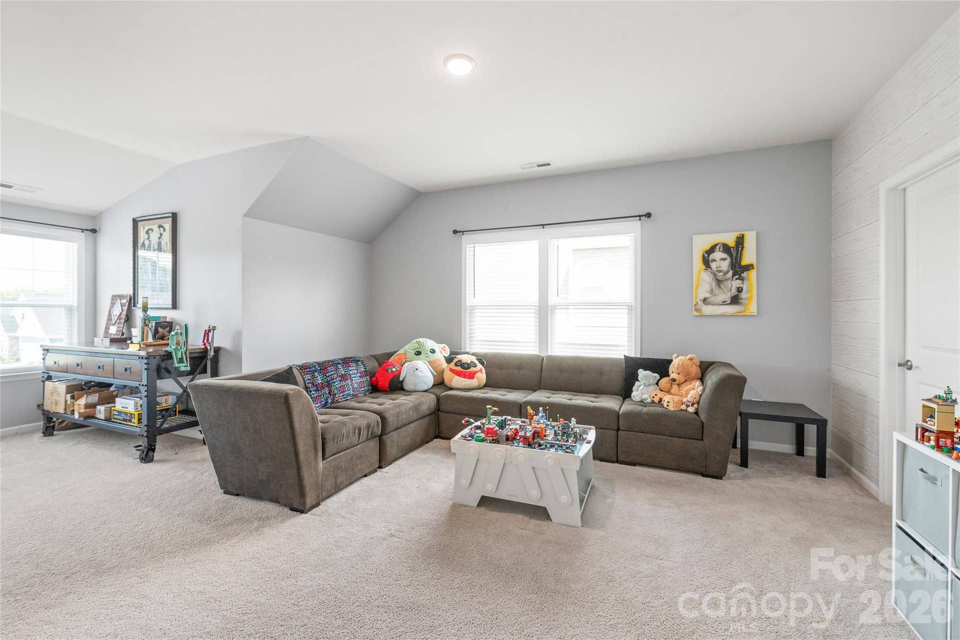 An oversized bonus room that connects directly to a shared full bath with Bedroom 2 - ideal as a home theater or game room.
