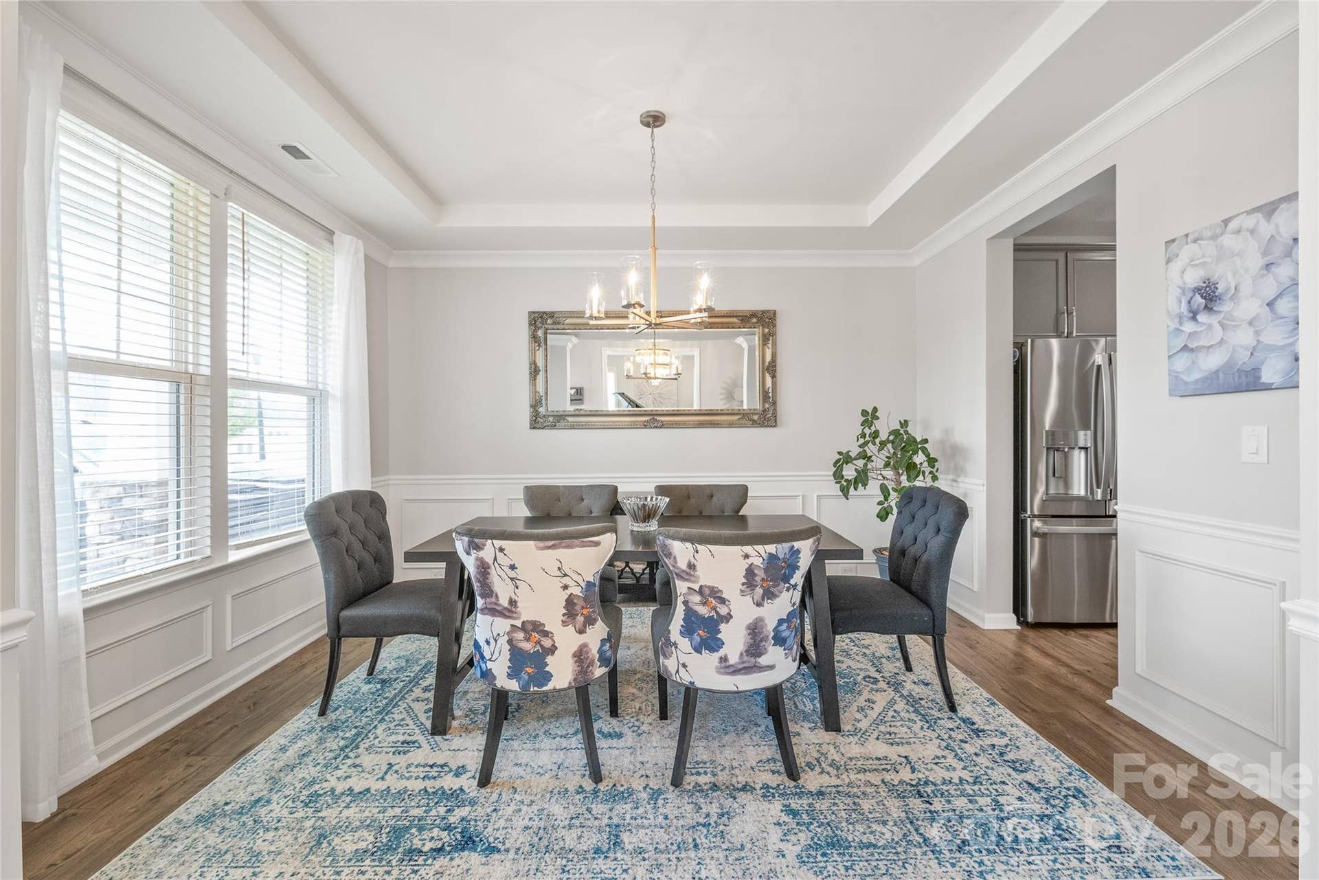 Effortlessly flowing from the dining room, the chefs kitchen offers a seamless layout built for intuitive serving and easy entertaining.