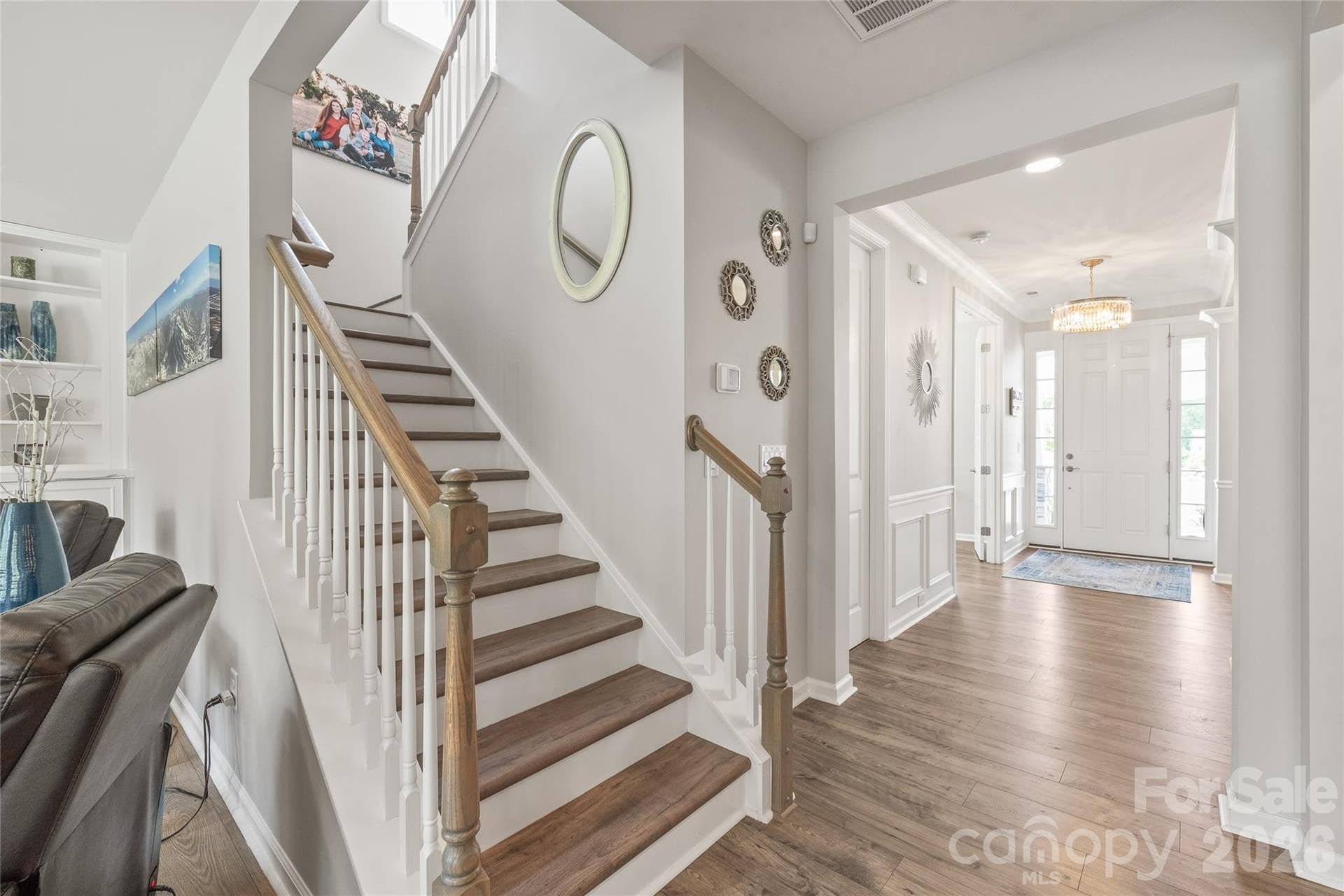 Featuring continuous LVP flooring, the staircase leads to a spacious second level boasting four well-appointed bedrooms.