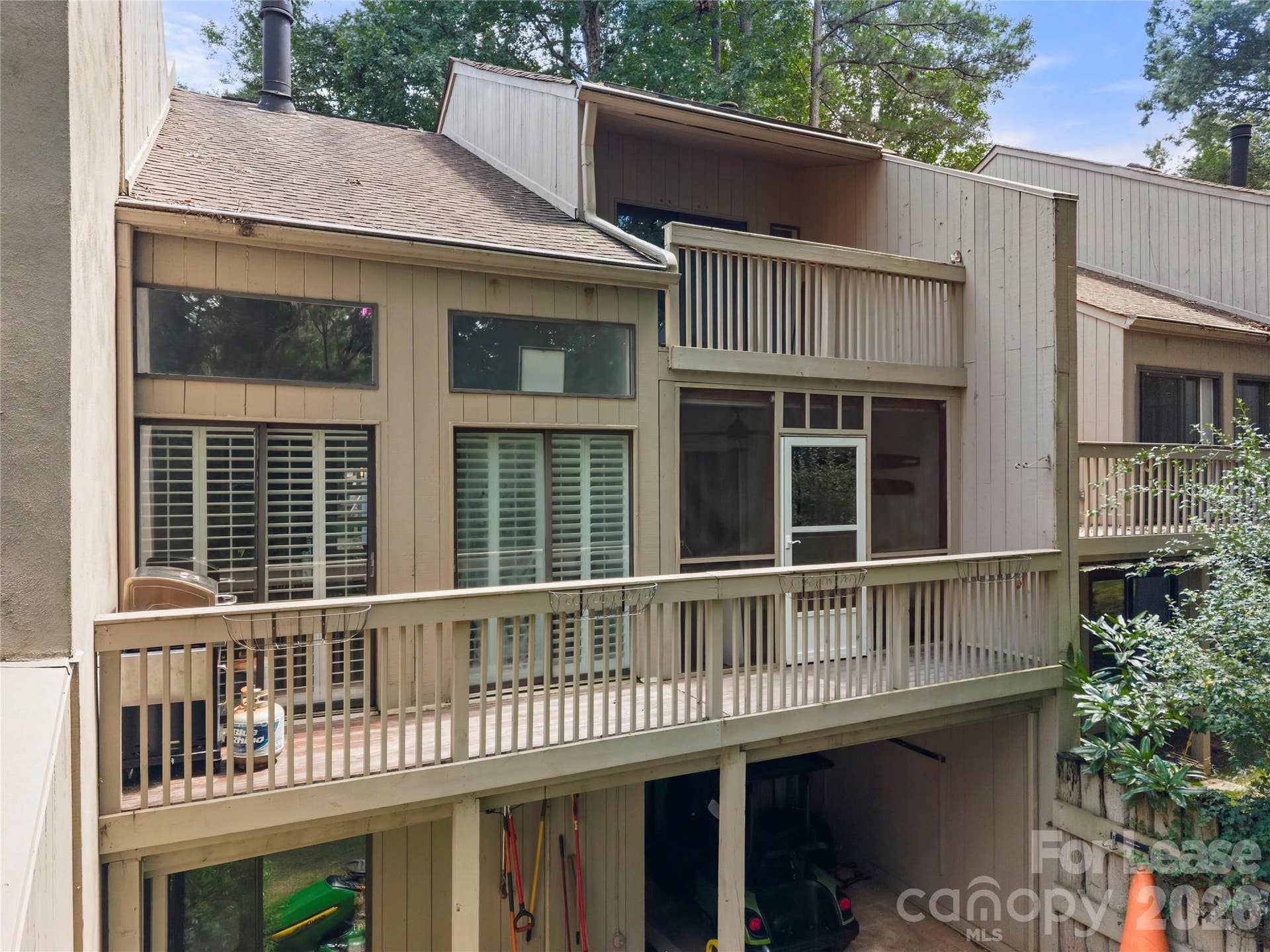222 Riverview Terrace, Lake Wylie, SC 29710 Rear view with all three levels of covered patio, screened in porch and covered deck upper level