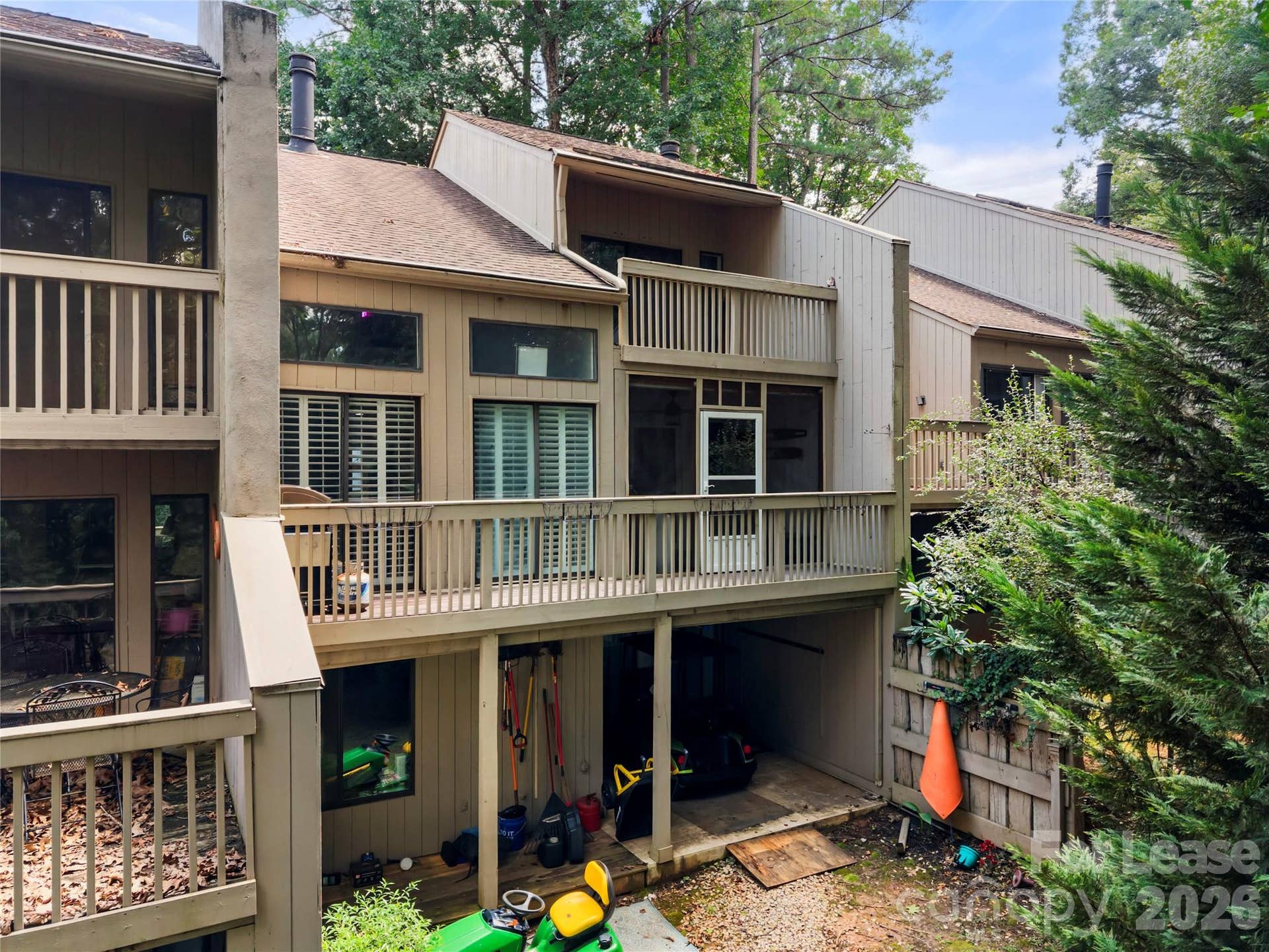 222 Riverview Terrace, Lake Wylie, SC 29710 Rear view showing the three levels of patio, screened in porch and upper cover deck