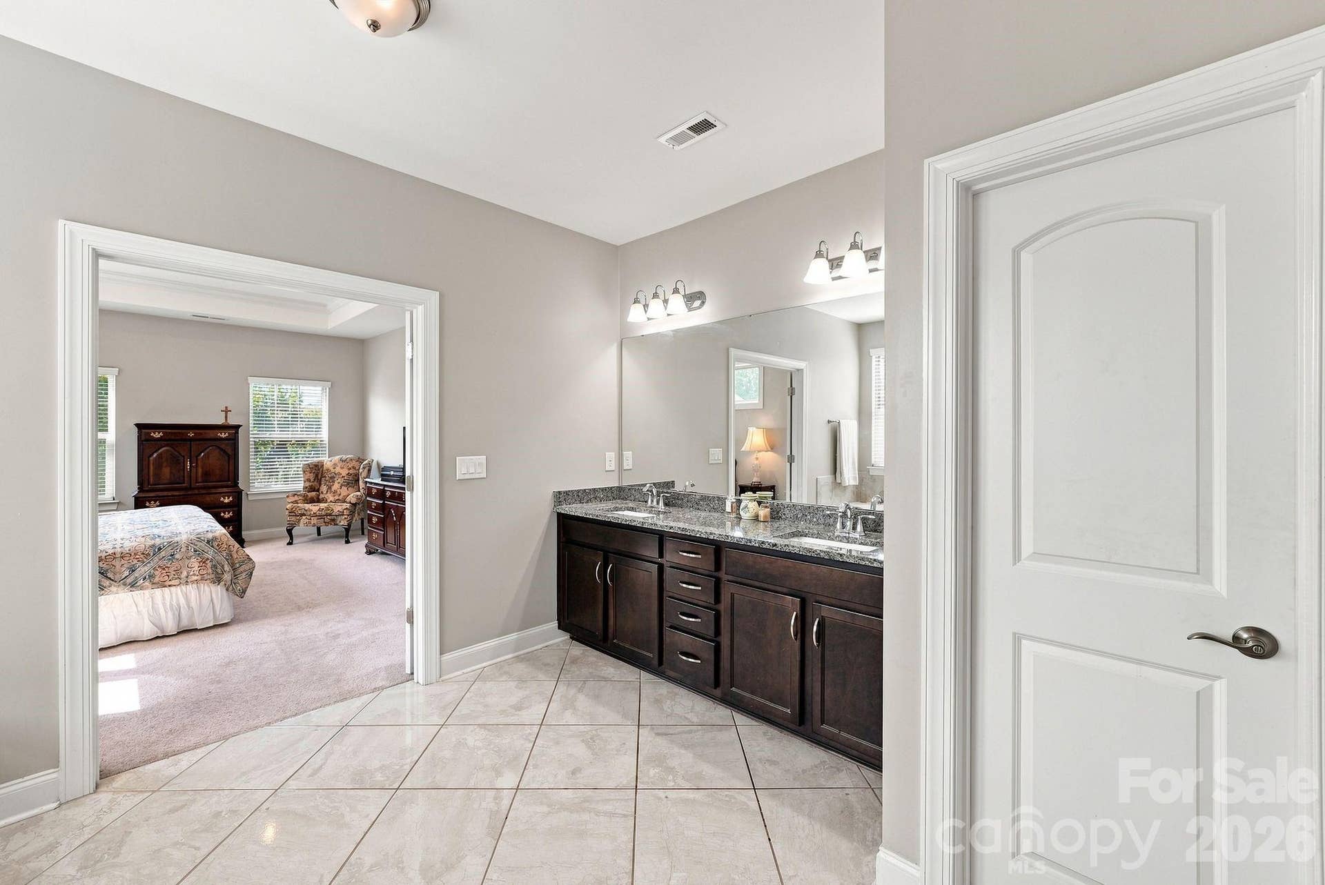 Dual vanities with granite countertop