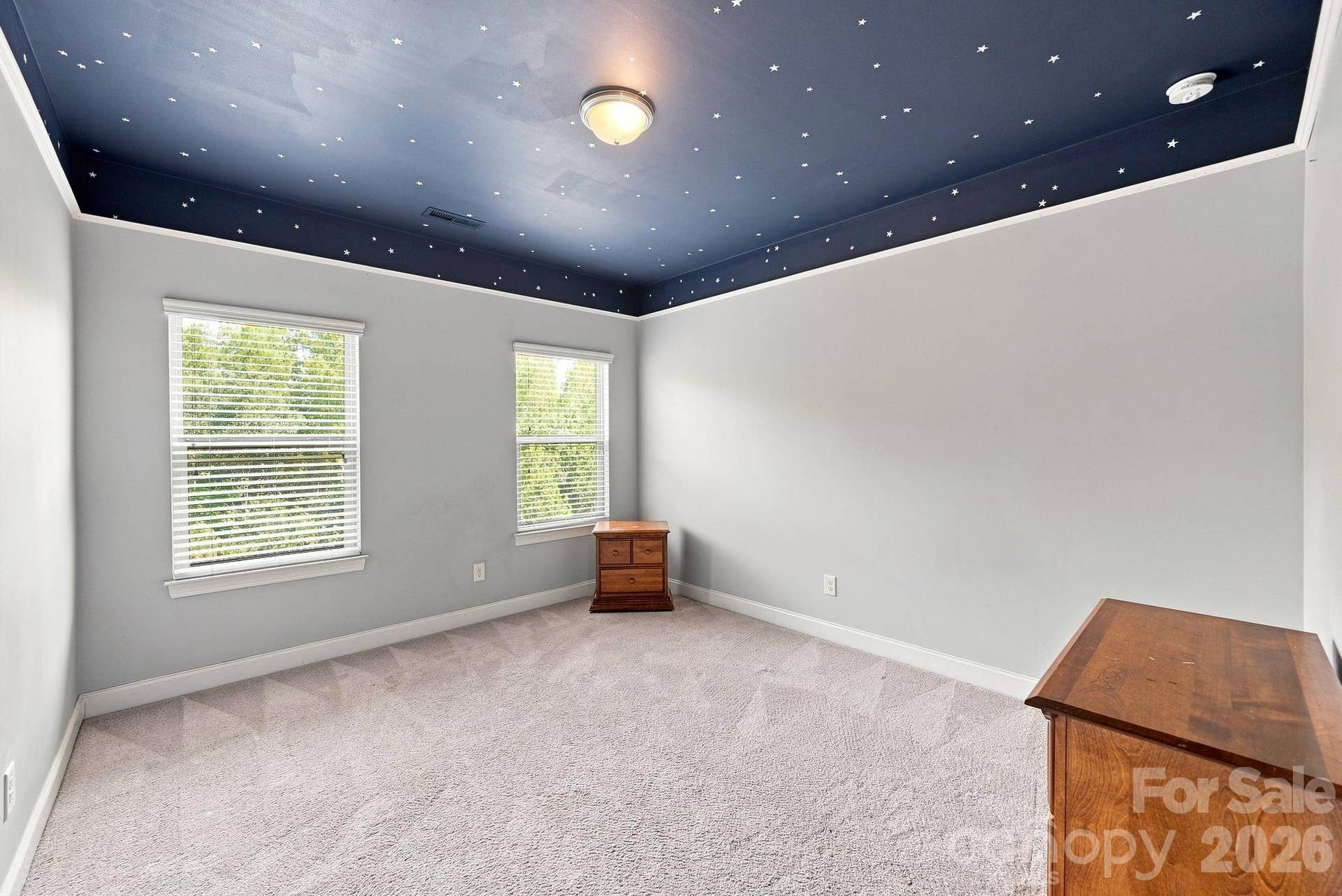 Generously sized  secondary bedrooms have walk-in closets
