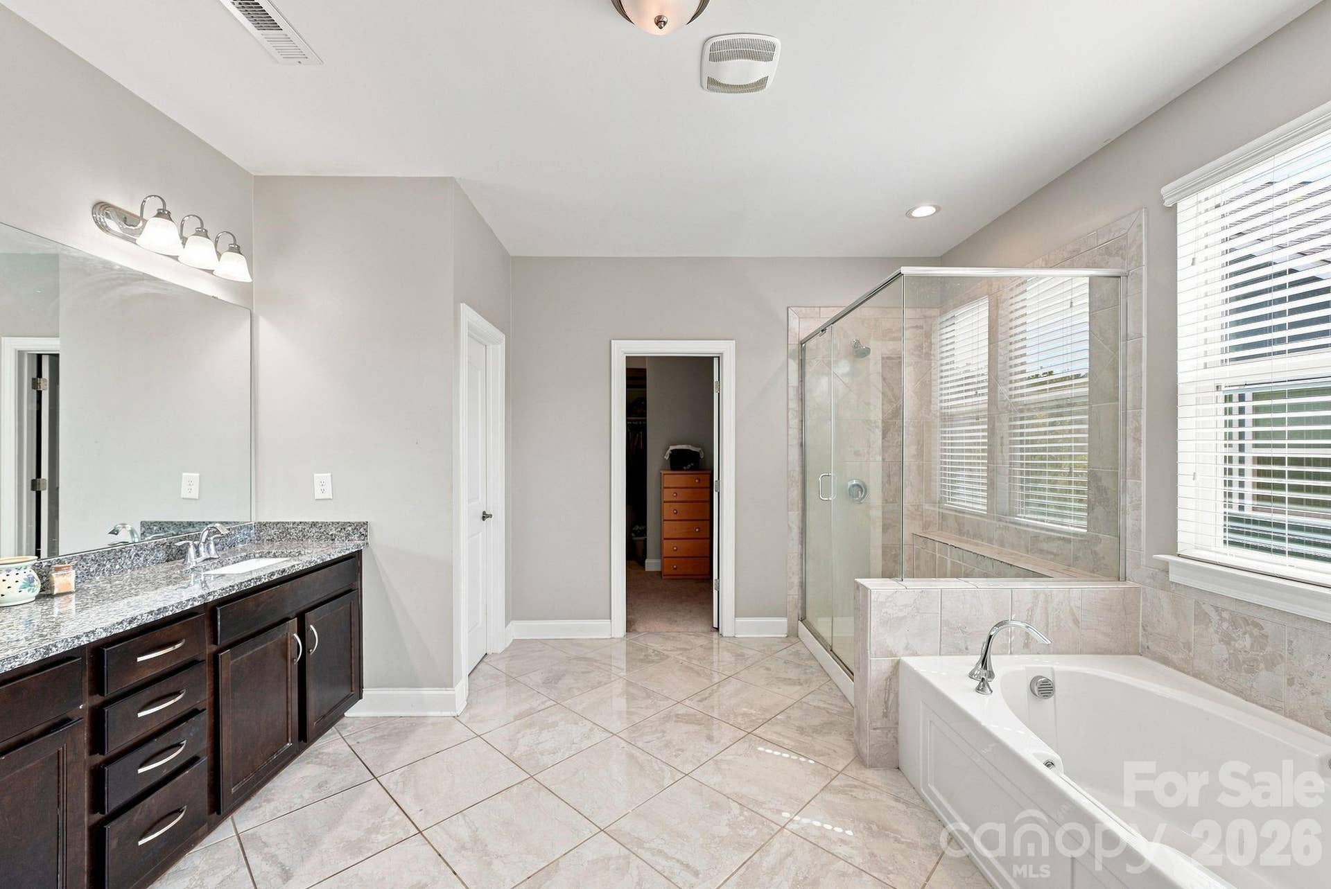 Primary bath has soaking tub and large walk-in shower