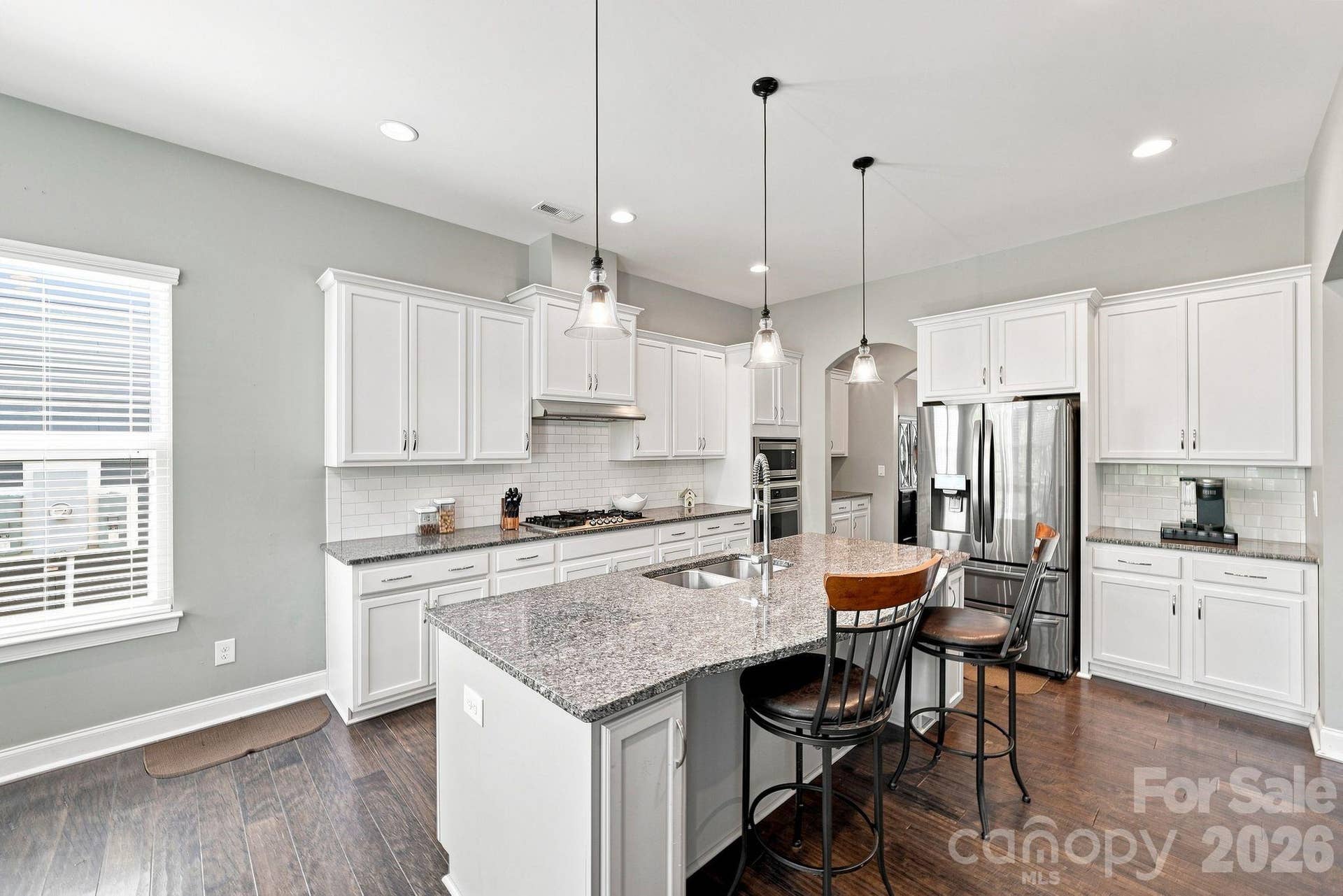 Plenty of storage with cabinets and walk-in pantry Island