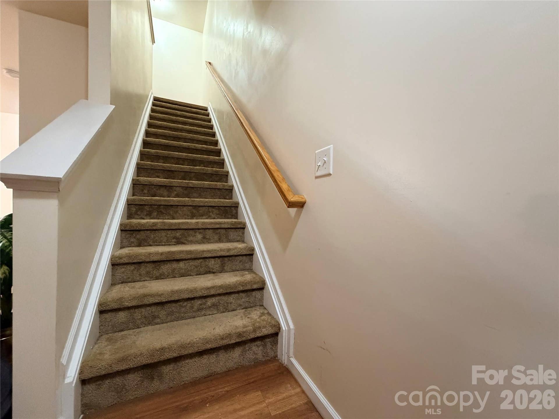 368 E Mills Avenue, Mooresville, NC 28115 Stairway leads to home's private upper-level living spaces.