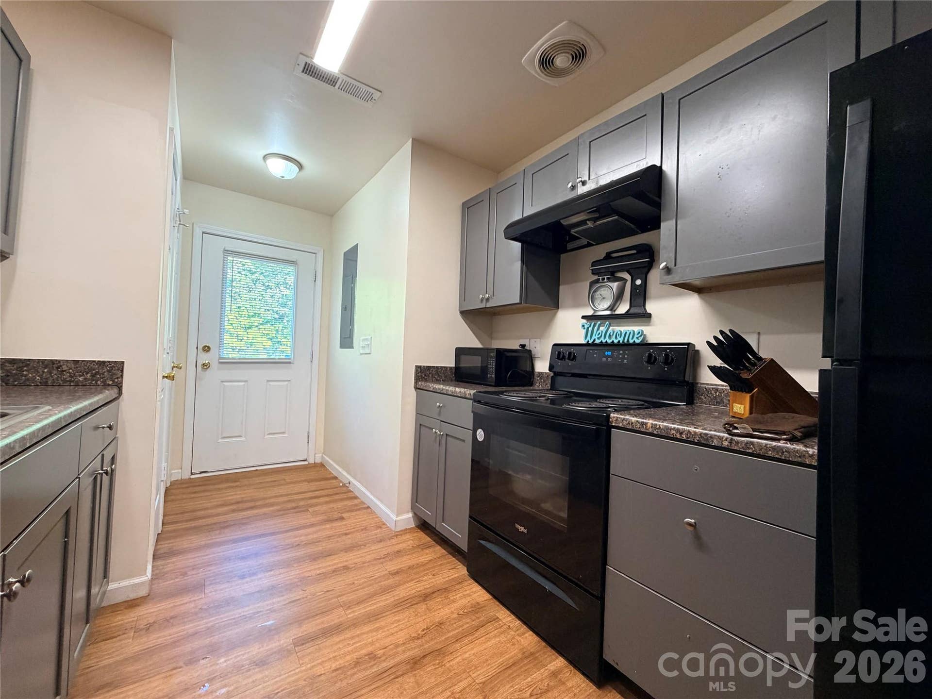 368 E Mills Avenue, Mooresville, NC 28115 Kitchen features range, dishwasher, refrigerator, ample cabinetry