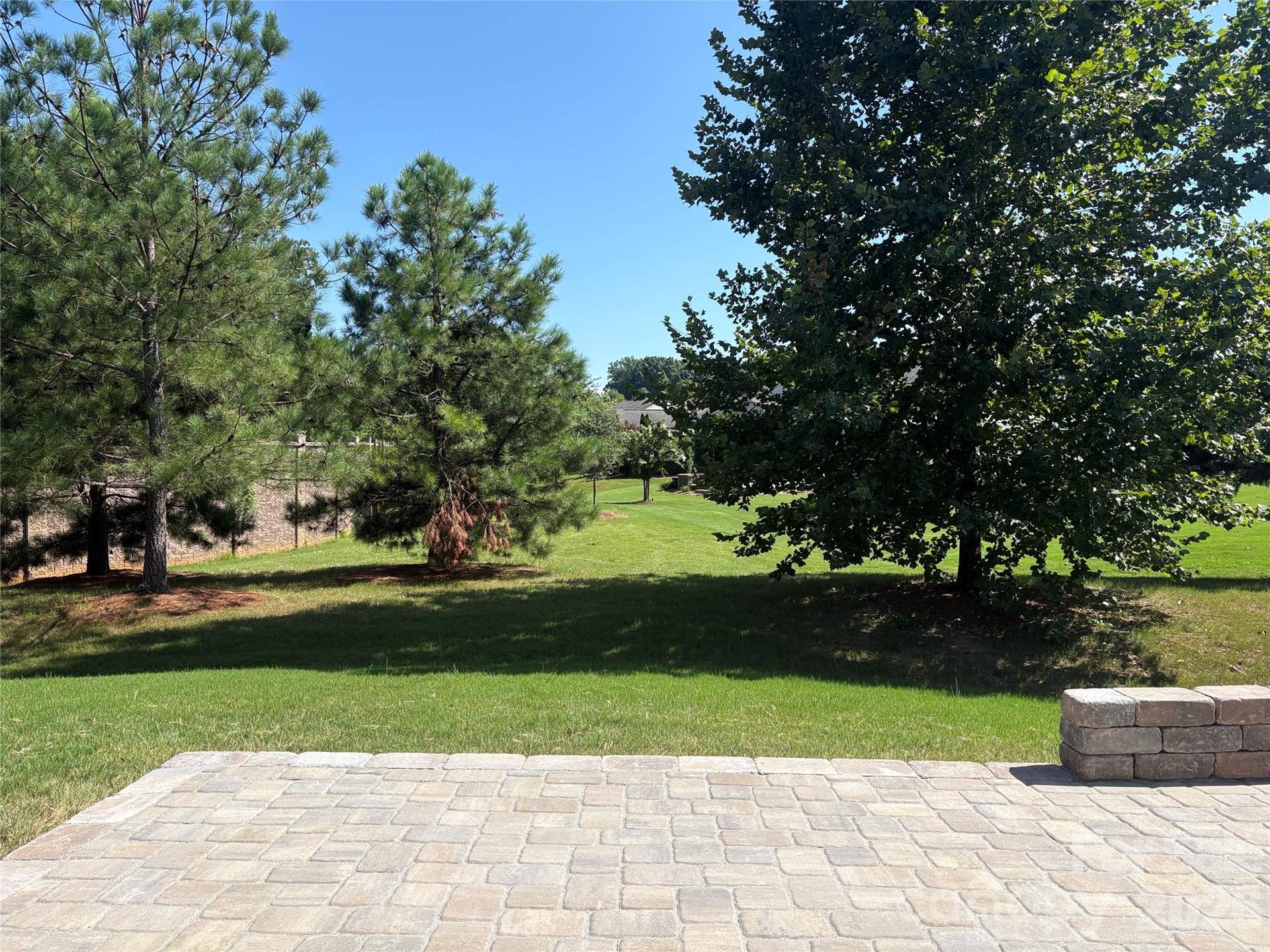 View from new paver patio off of the sunroom