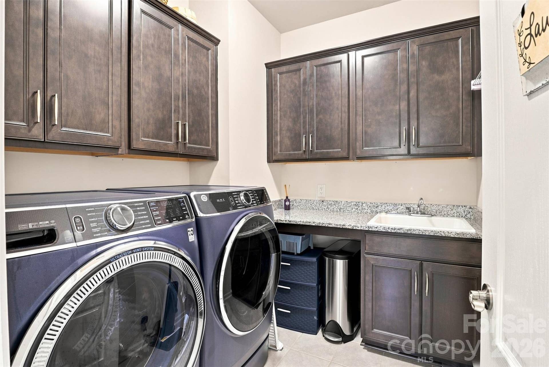 15704 Reynolds Drive, Indian Land, SC 29707 Laundry room with lots of cabinets