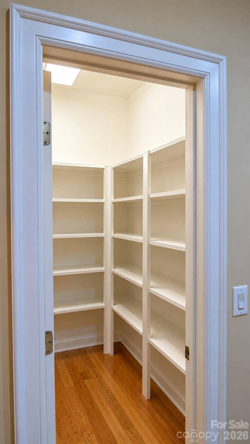 5480 Glen Forest Drive, Charlotte, NC 28226 Huge walk-in pantry in kitchen with sturdy wood shelves. Professional pictures est for 10/17. We're Still working inside the house for you.