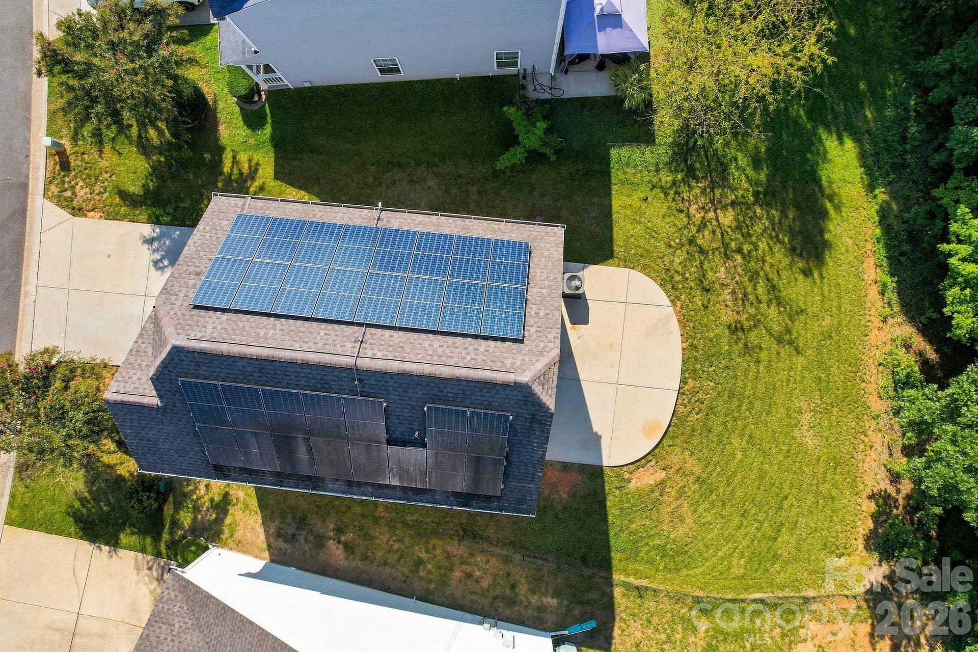 Aerial view of home and solar panels