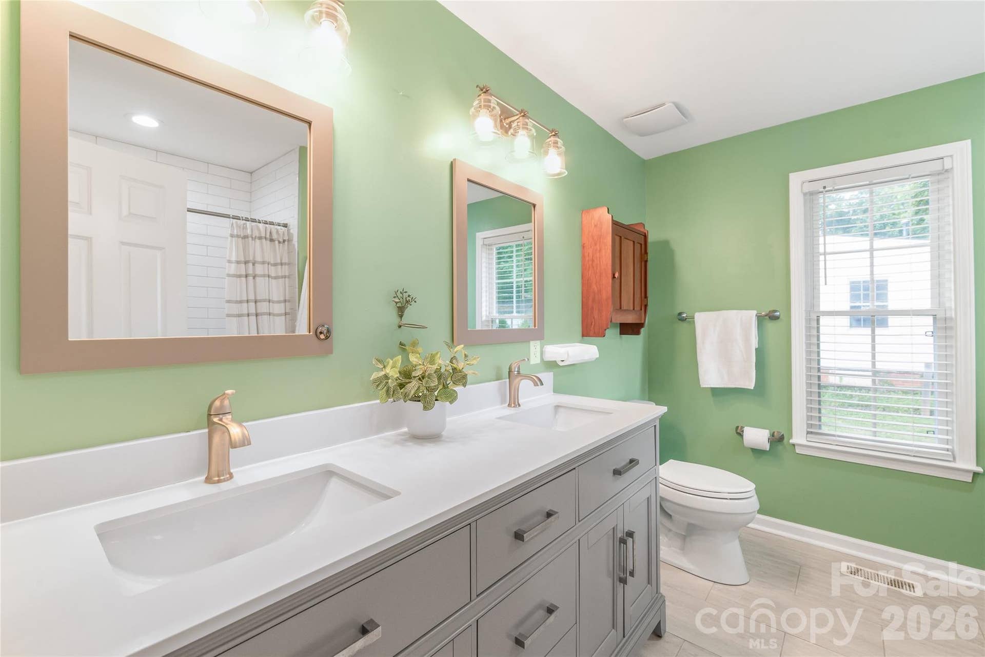 A stylishly updated primary bathroom designed for daily relaxation, featuring contemporary fixtures, updated tile work, and crisp, modern finishes.