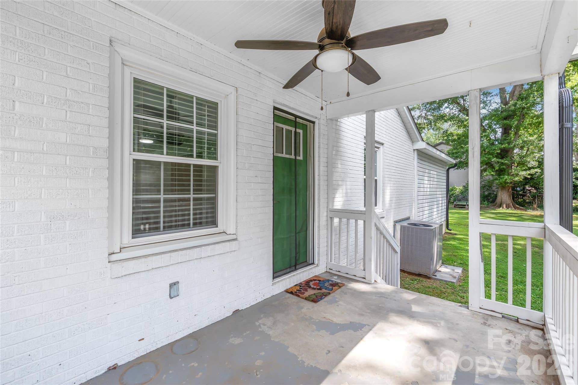 Located directly off the main living room, this charming covered side porch extends your living space outdoors.