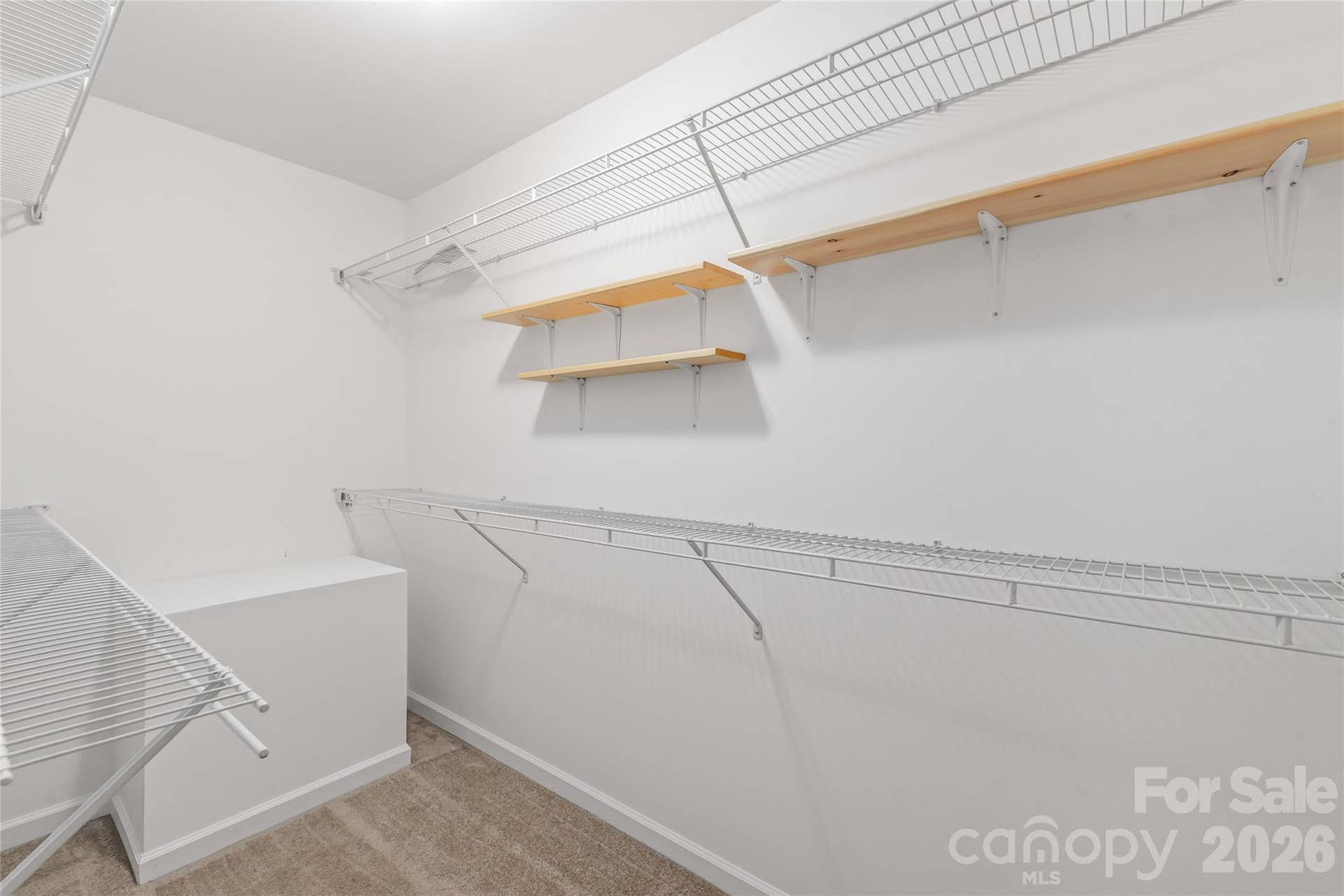 A dedicated walk-in closet in the primary suite designed to keep your wardrobe fully organized with generous hanging space and easy accessibility.
