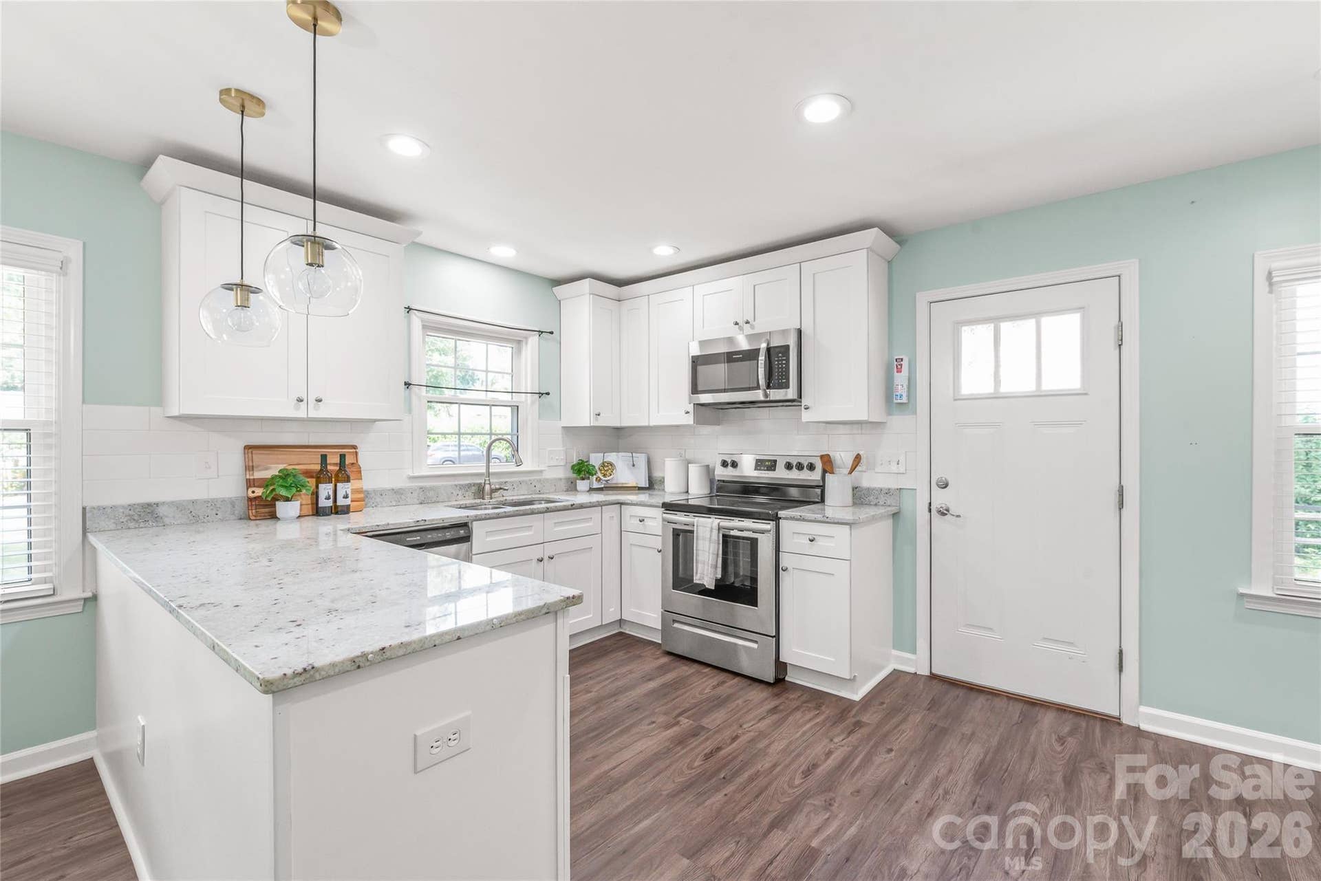 Chefs Kitchen (Renovated 2019): Designed for functional elegance, featuring custom white shaker cabinetry, smooth soft-close drawers and doors, and convenient pull-out trays.
