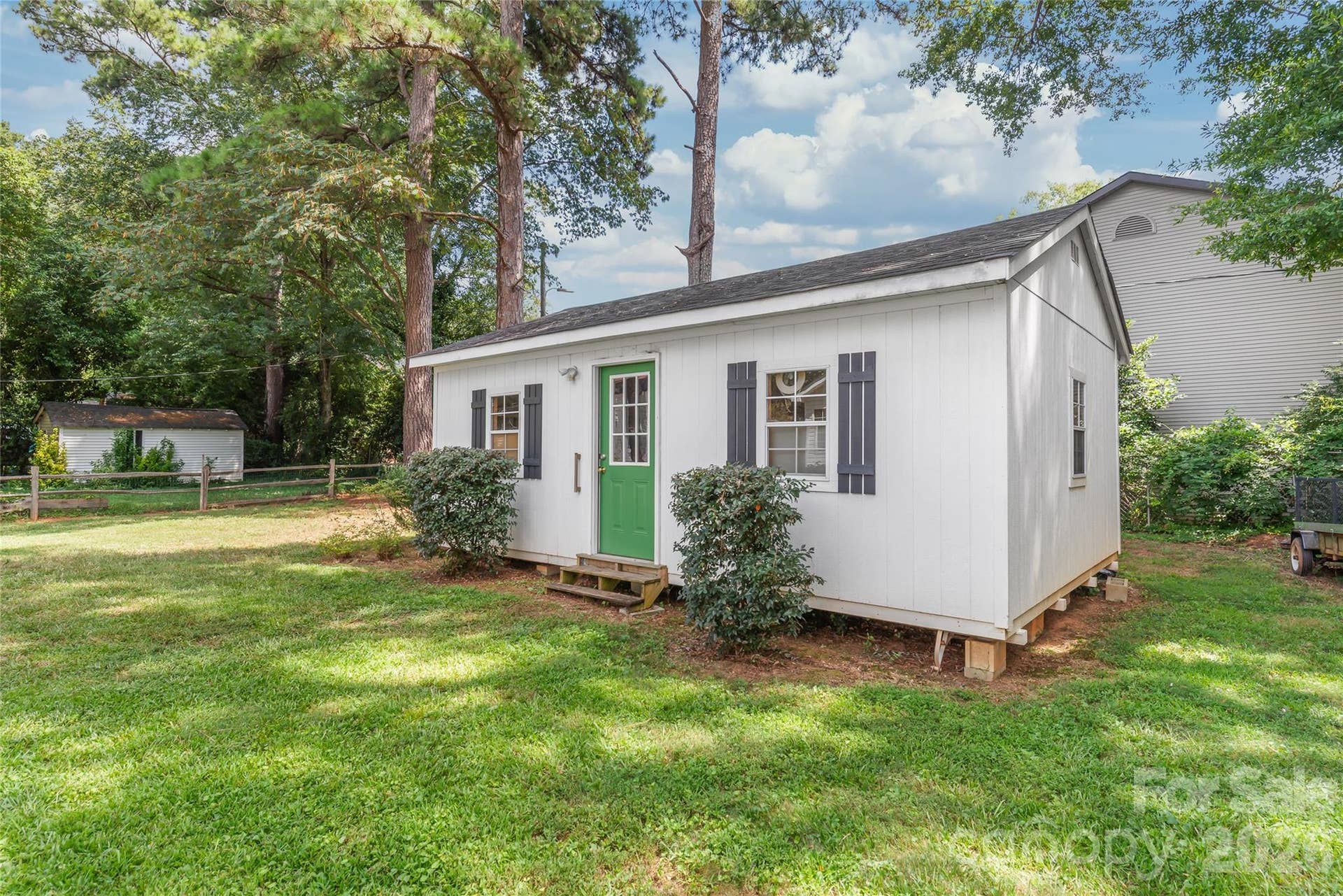 Whether youre a woodworker, crafter, or just need extra storage space, this custom workshop in the backyard is built to match the home and ready for your next project!