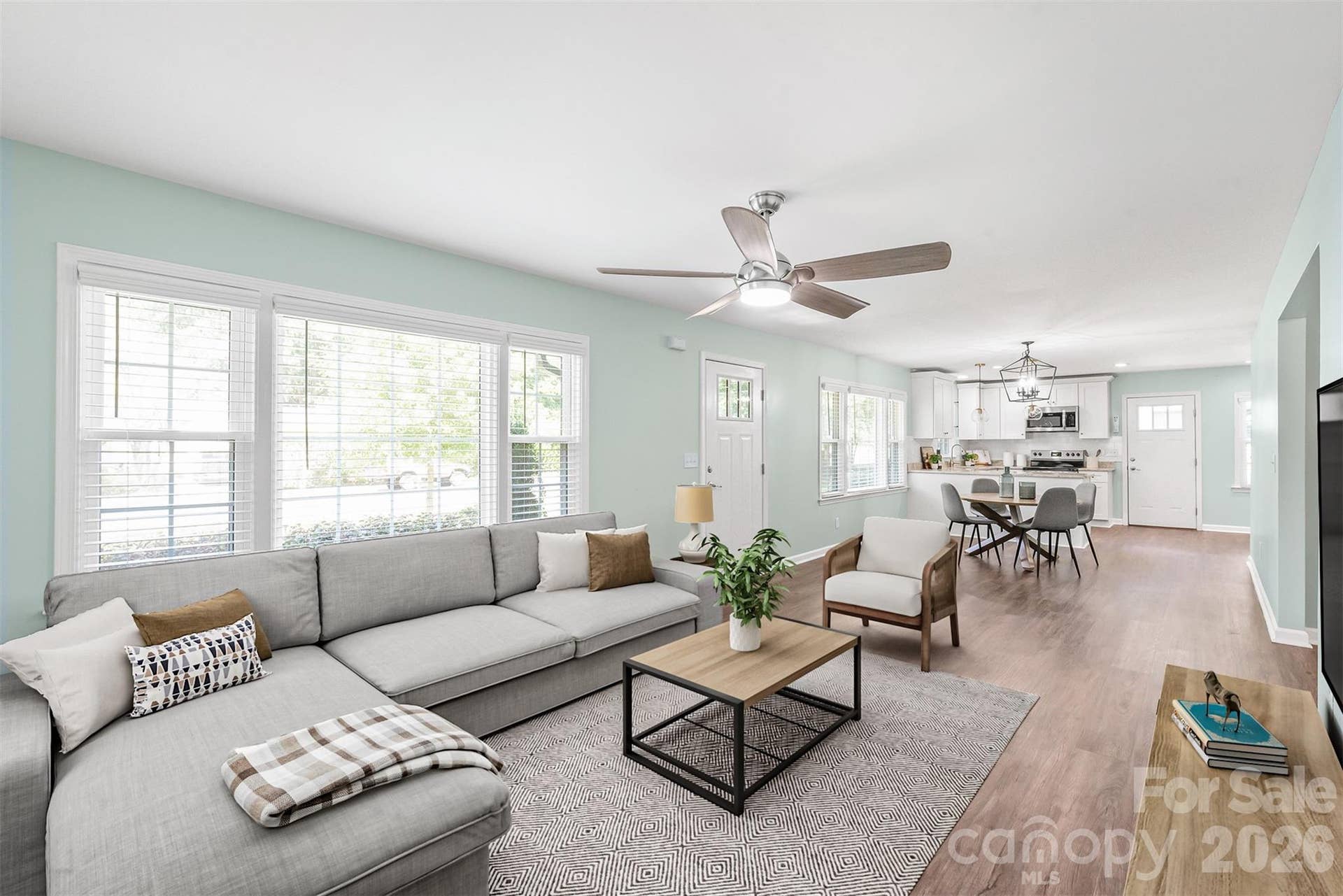 Thoughtfully designed open layout connecting the dining space smoothly into the main living room...ideal for seamless everyday living and effortless hosting. Virtually Staged.