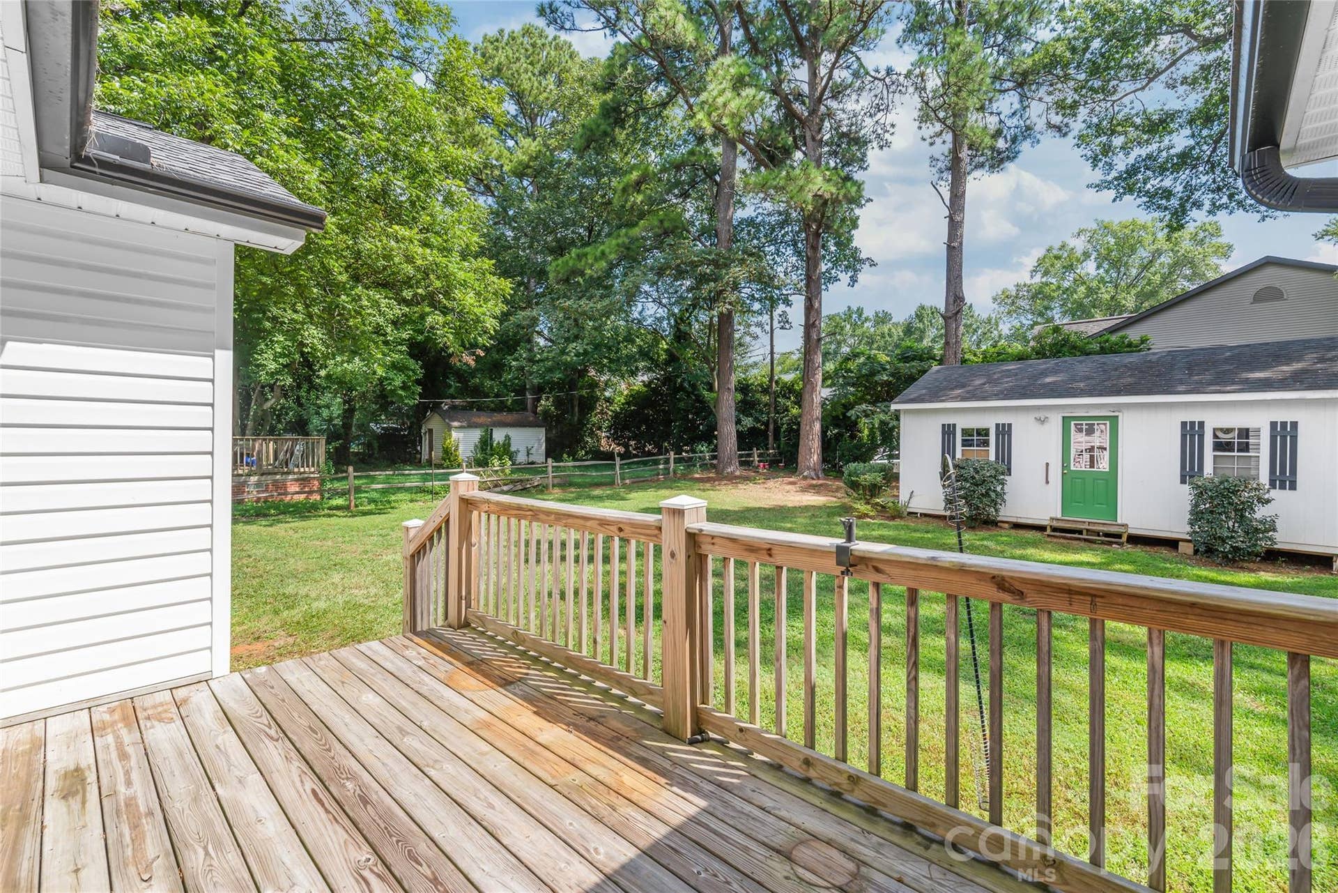 Step directly from your primary bedroom onto a private back deck, creating a seamless connection between your personal retreat and outdoor relaxation.
