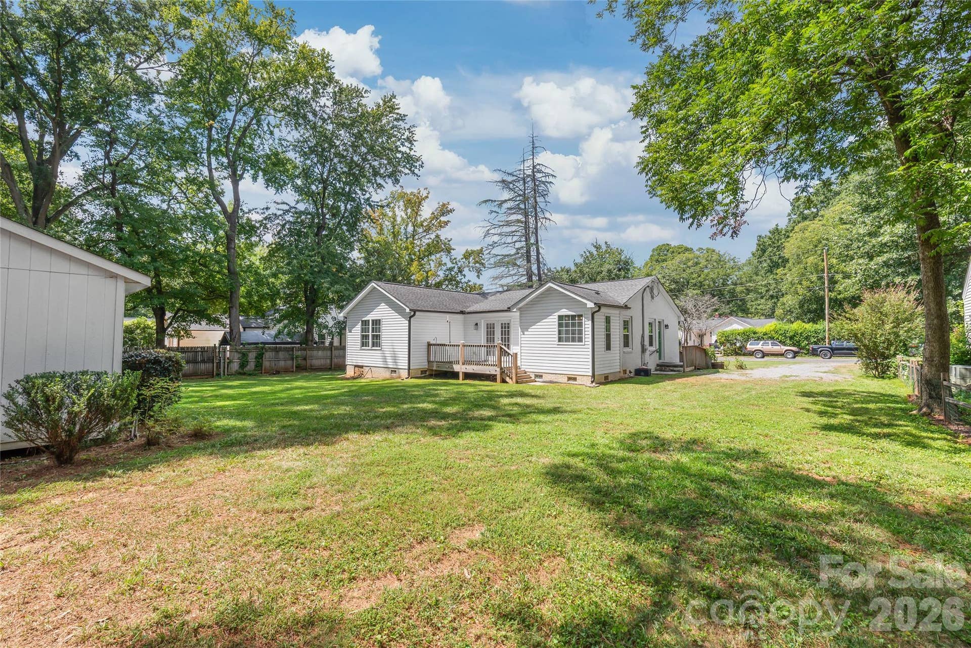 This spacious lot is surrounded by beautiful mature trees, giving you a serene, private backyard retreat right in the heart of Rock Hill.