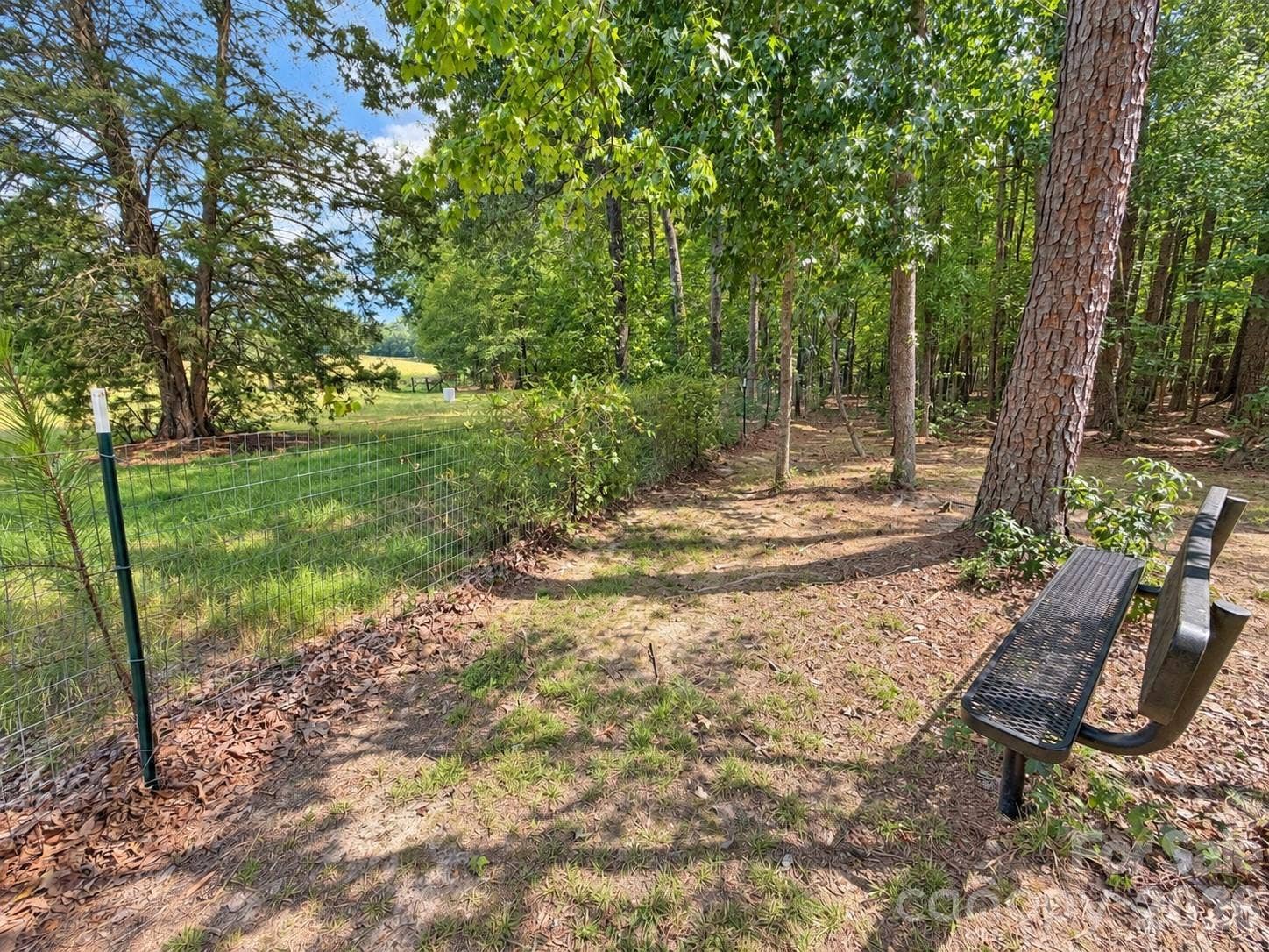 9201 Providence Road S, Waxhaw, NC 28173 bench at the back of the property for sitting to watch the neighboring farm animals