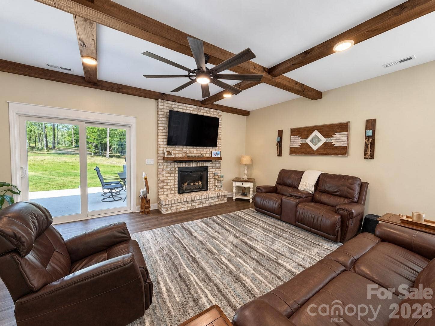 9201 Providence Road S, Waxhaw, NC 28173 Living room with new wood beams, lighting, and stone fireplace