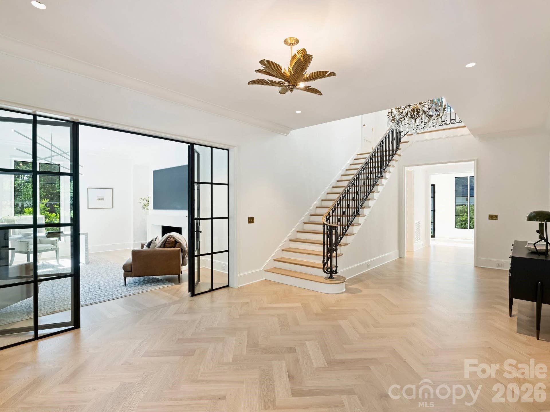Grand foyer with herringbone floors