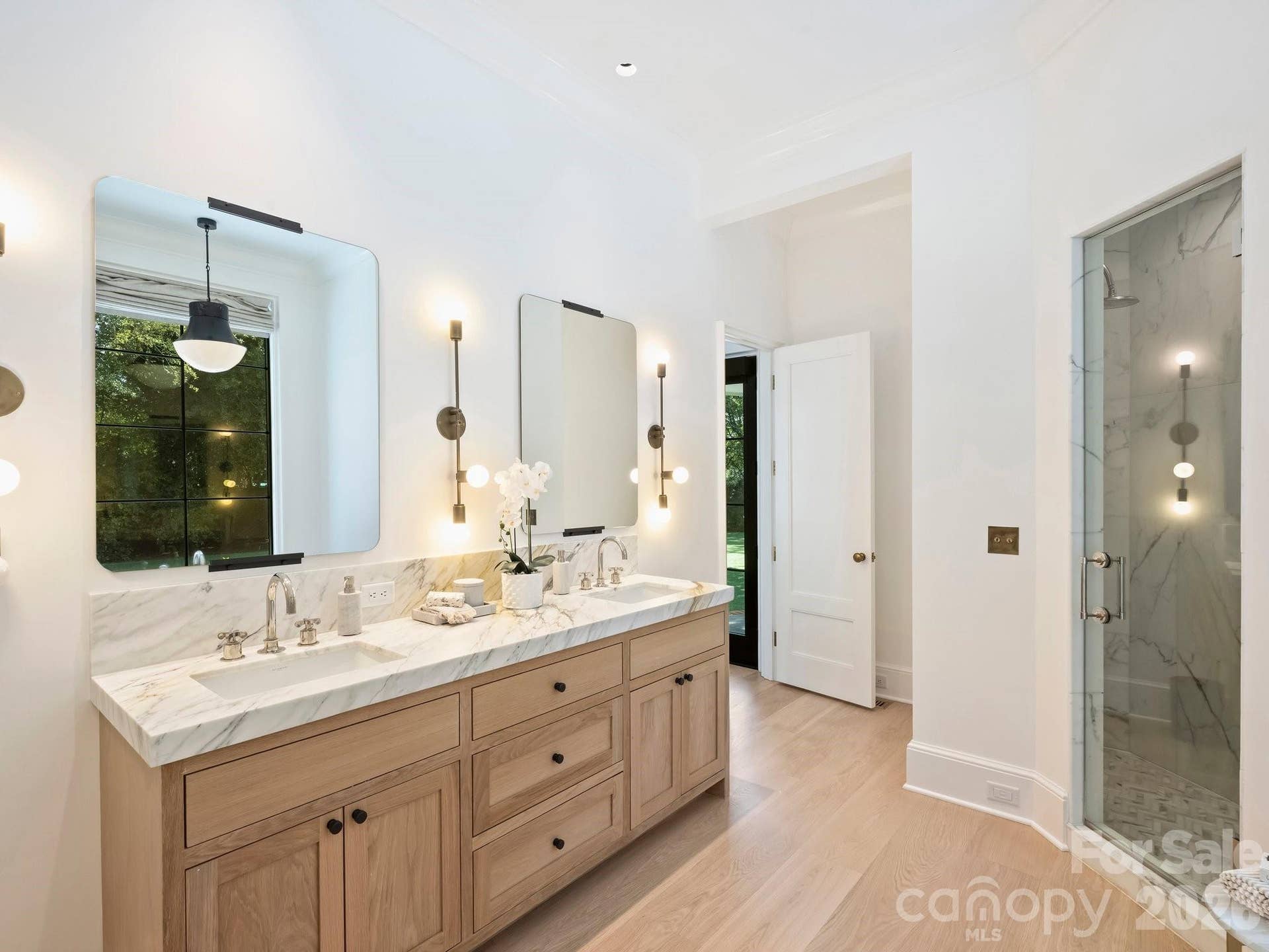 Primary Suite bath with the same beautiful Panoazzo marble counters, Waterworks fixtures, deep marble shower and private soaking tub