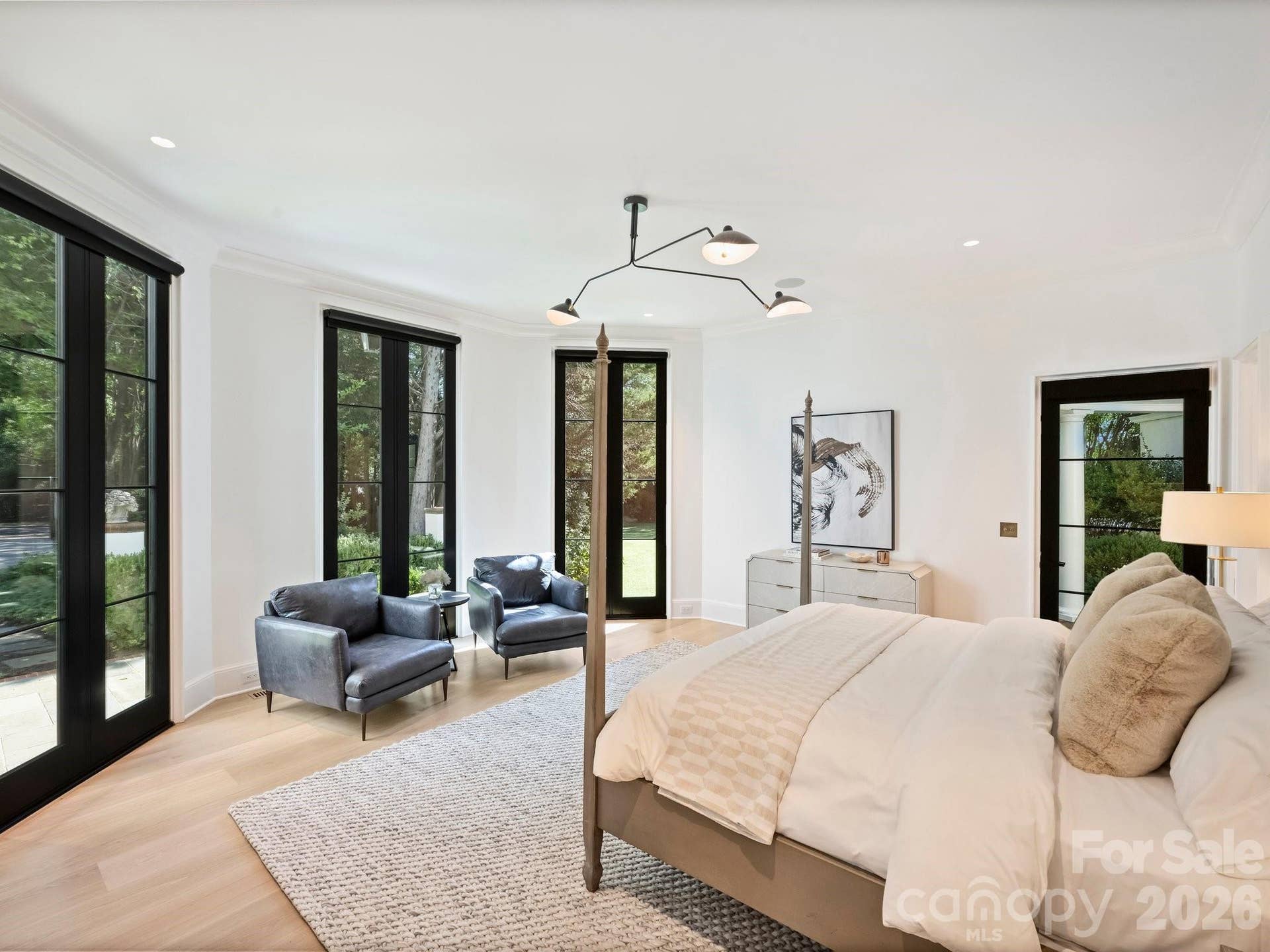 Primary Suite is located on it's own wing with floor to celing glass doors overlooking your courtyard