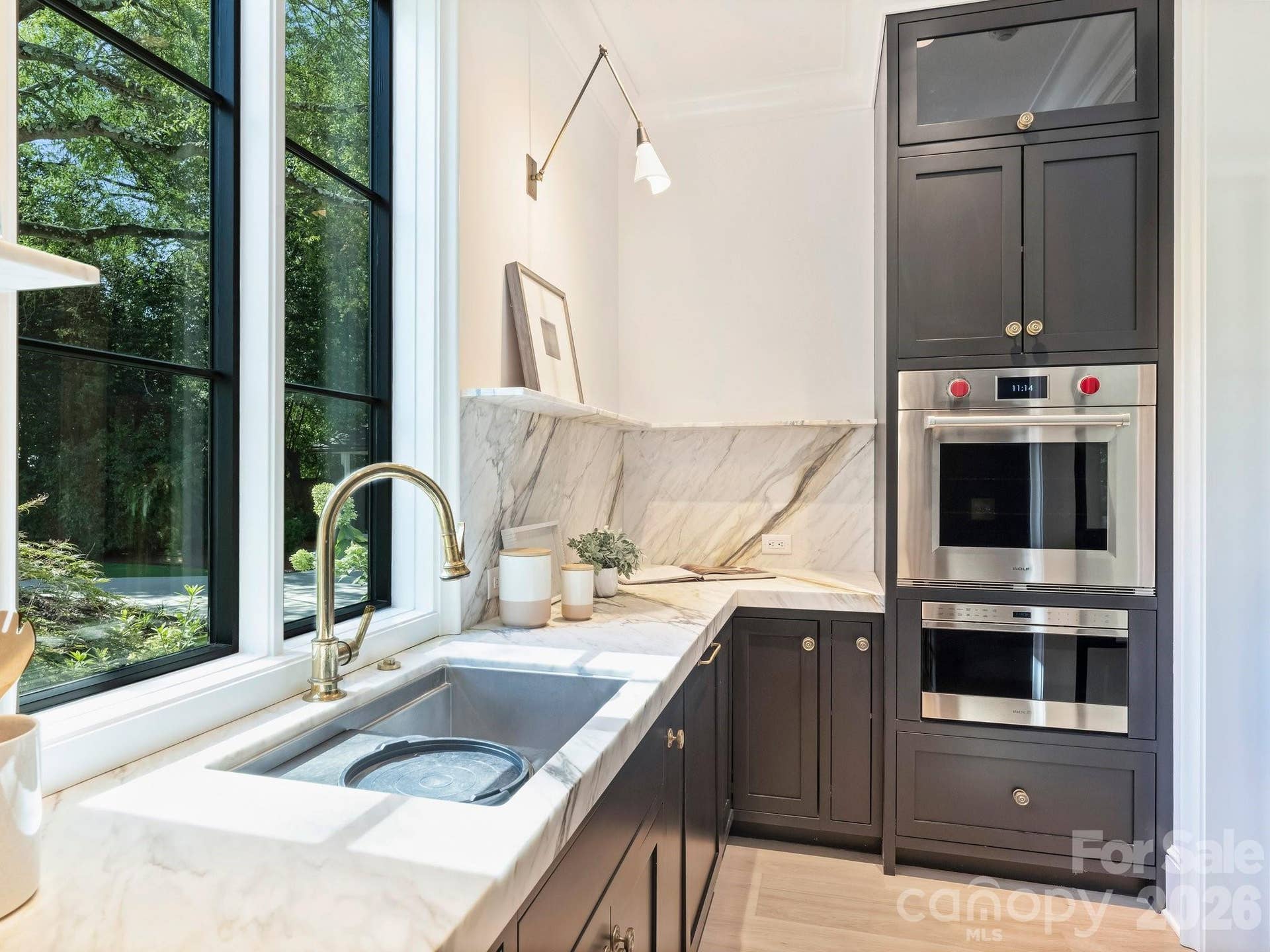 Microwave and wall oven with a second dishwasher and sink with Waterworks fixture