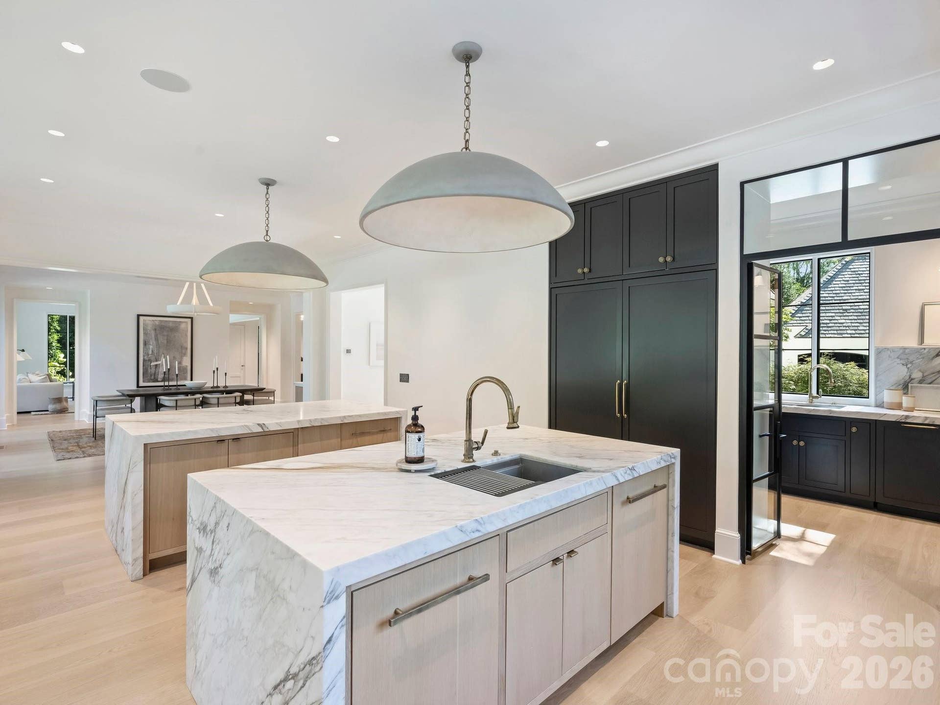 Panoazzo Marble island with custom mitered edges and Waterworks fixture