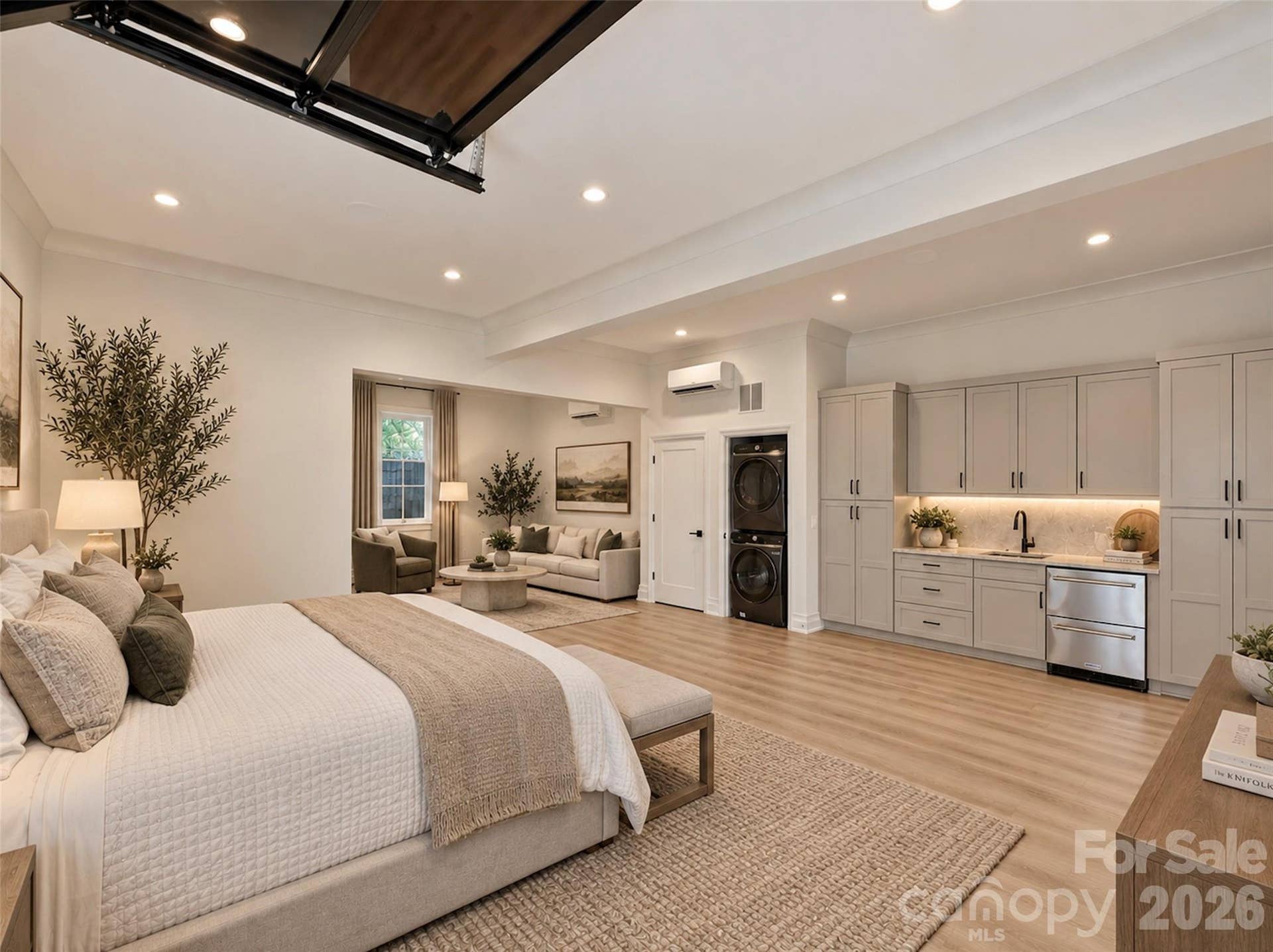 2nd living quarters with full bath, kitchenette and laundry virtually staged as a guest quarters