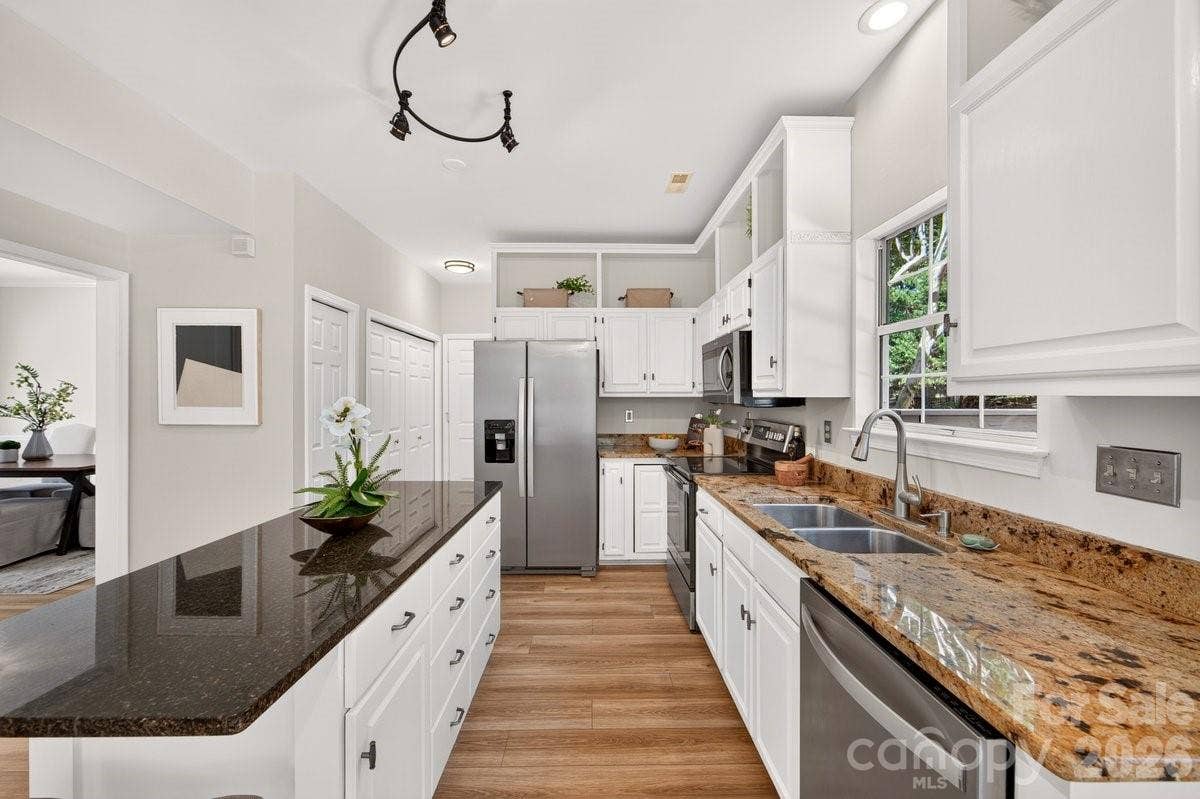 2901 Firewood Drive, Matthews, NC 28105 The kitchen features an island with wonderful extra storage space.