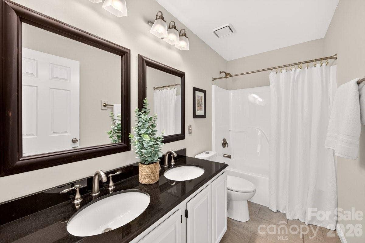 2901 Firewood Drive, Matthews, NC 28105 Hall Bath with dual vanities.