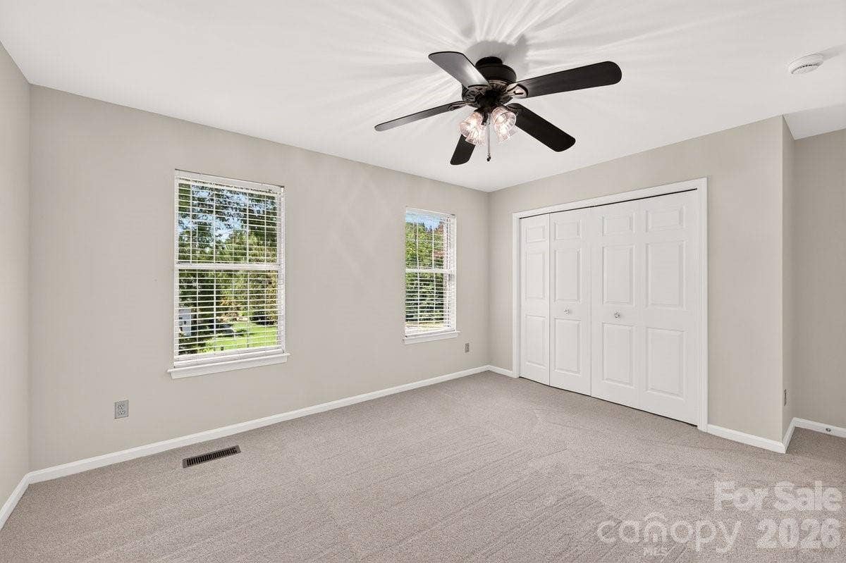 2901 Firewood Drive, Matthews, NC 28105 Bedroom 2. There are double door closets in all secondary bedrooms.
