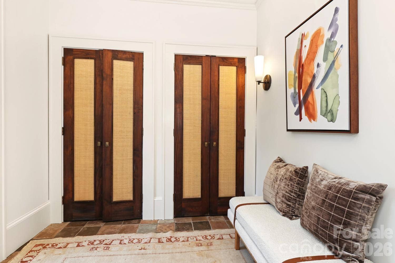 Mud room with custom doors and storage
