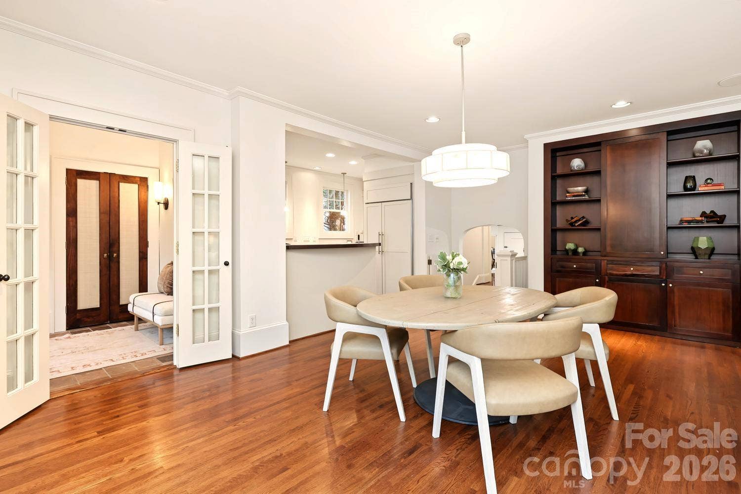 Custom built ins and view to kitchen and rear entry