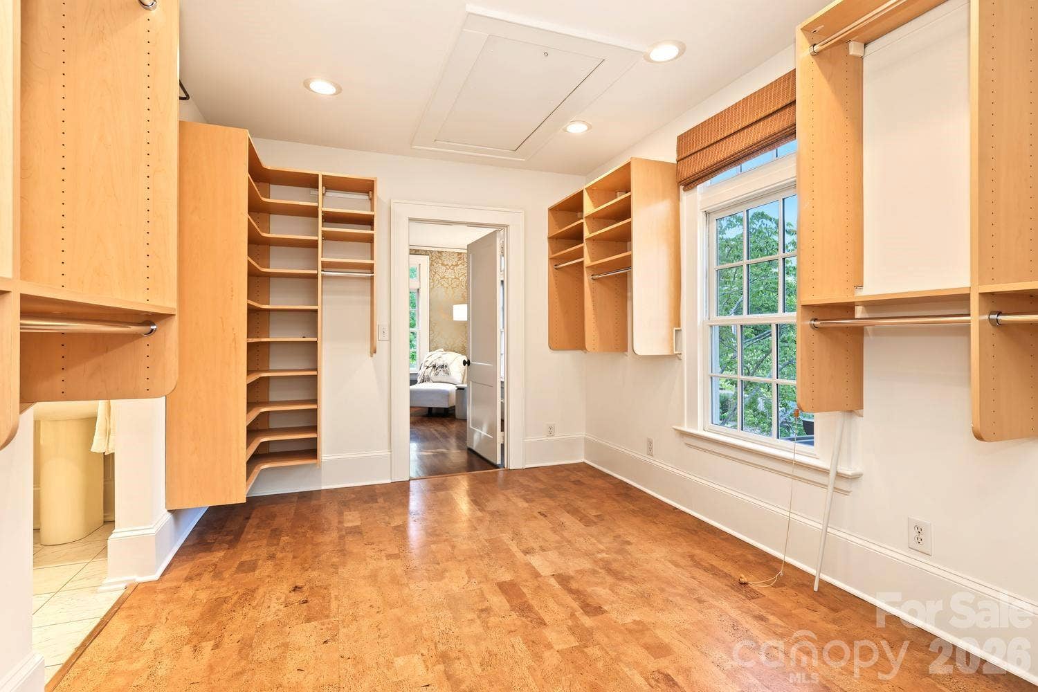 Large primary closet with custom built ins