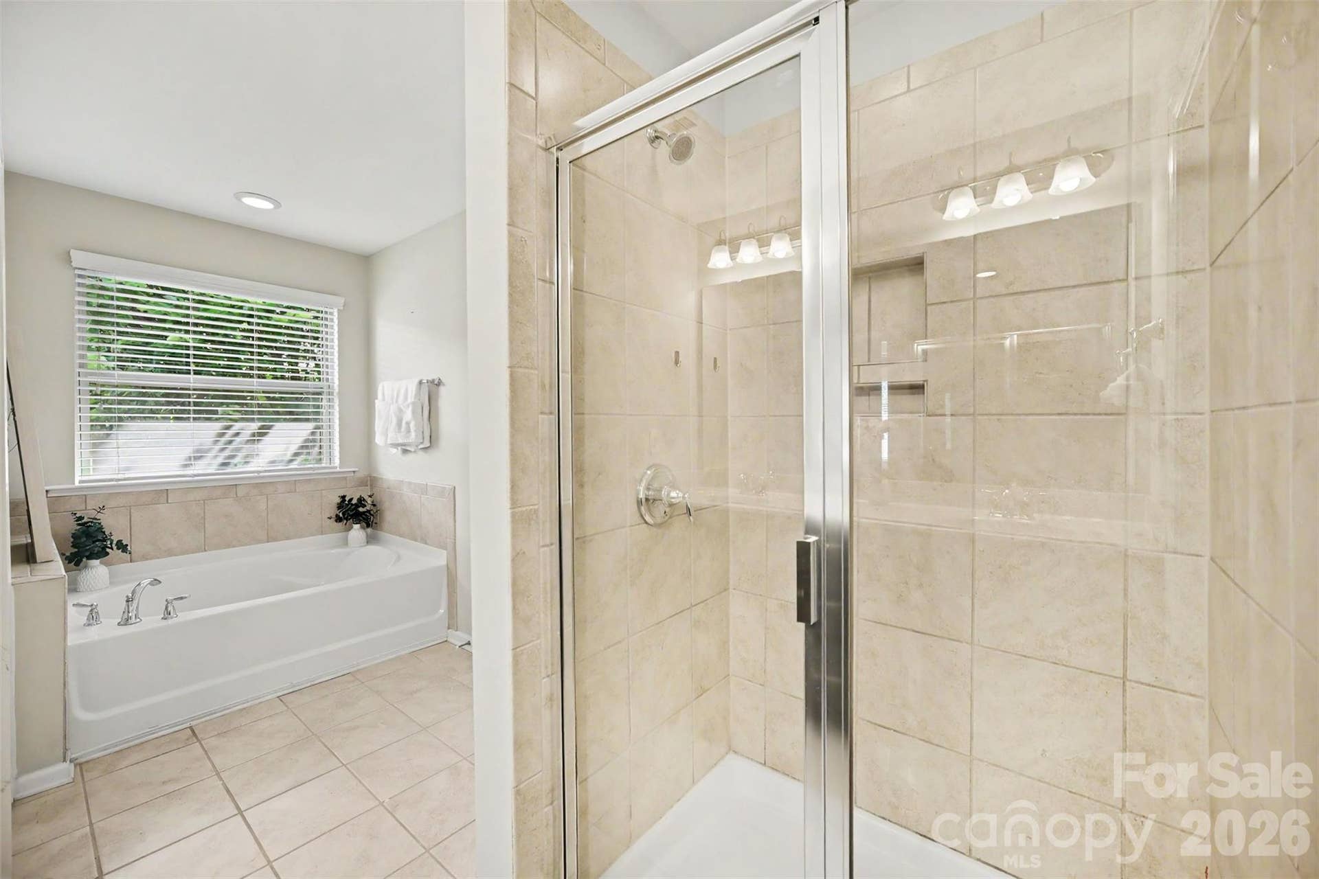 Primary bathroom with garden tub and walk-in shower