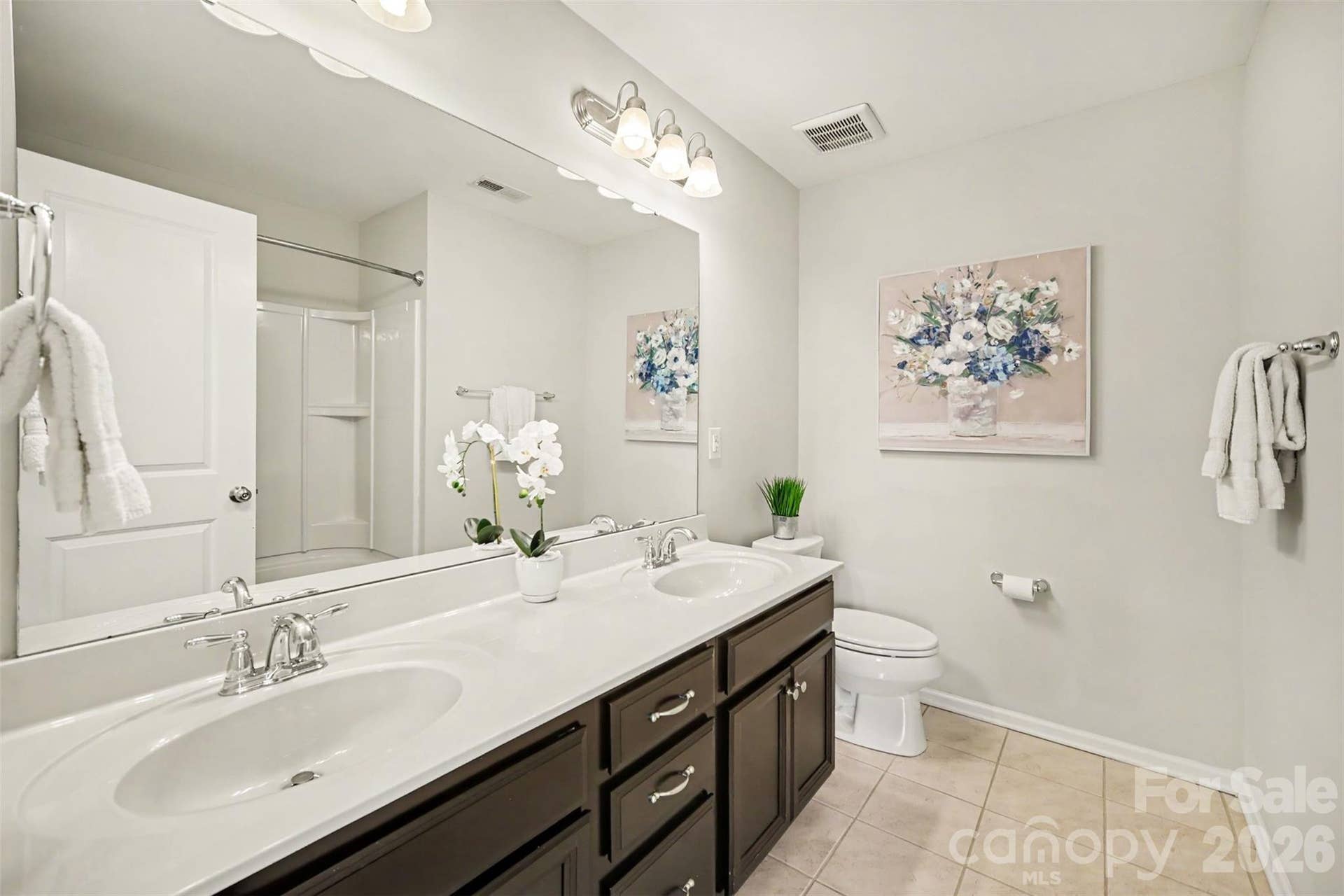 Full bathroom with double vanity conveniently located near the secondary bedrooms