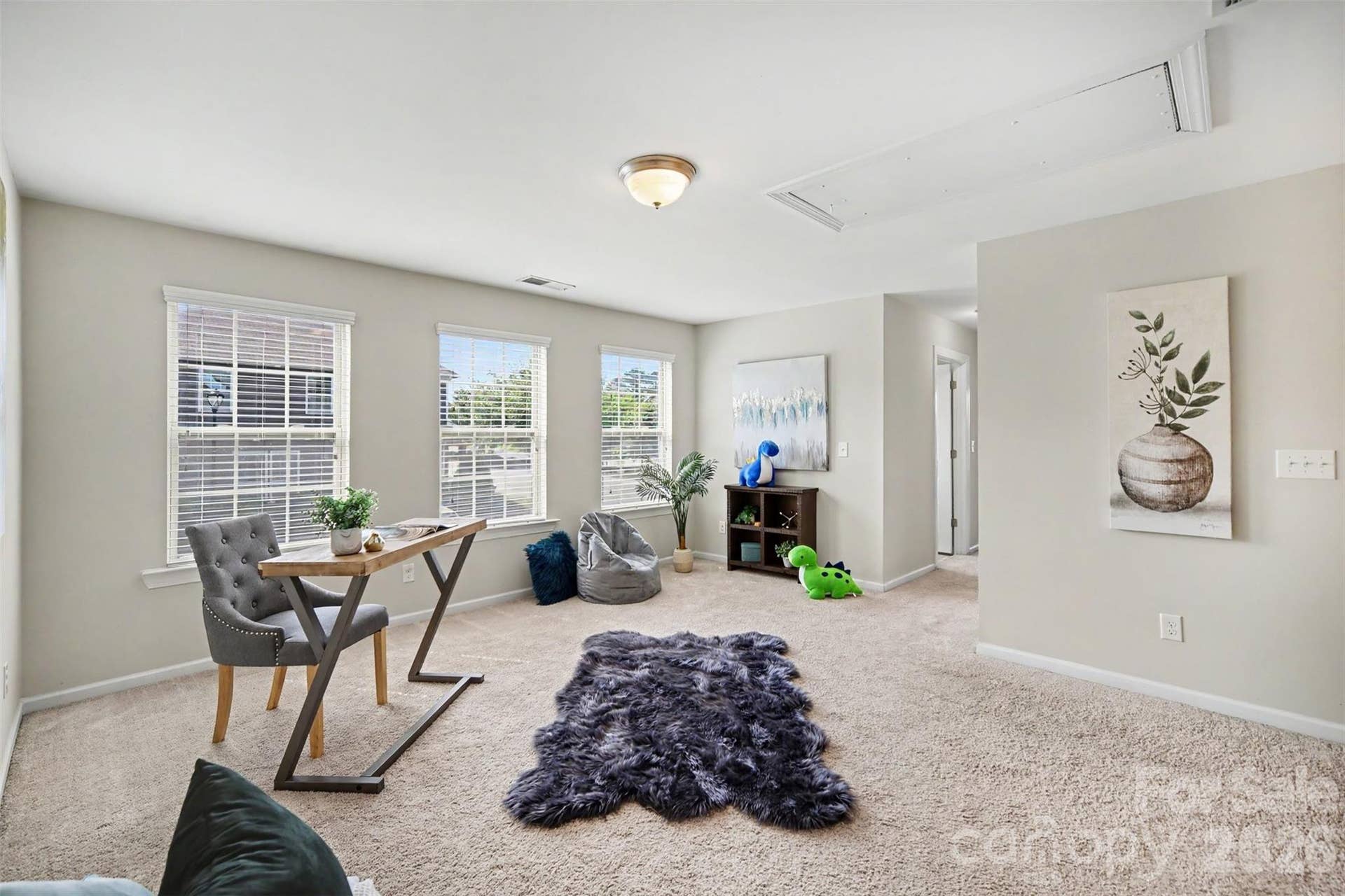 Large loft located in the center of the upstairs floor plan, with closet