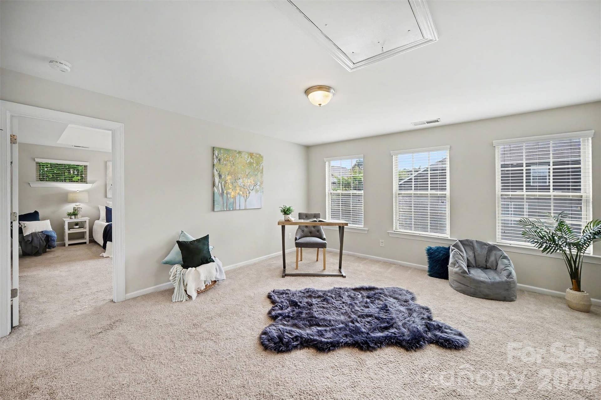 Large loft located in the center of the upstairs floor plan, with closet
