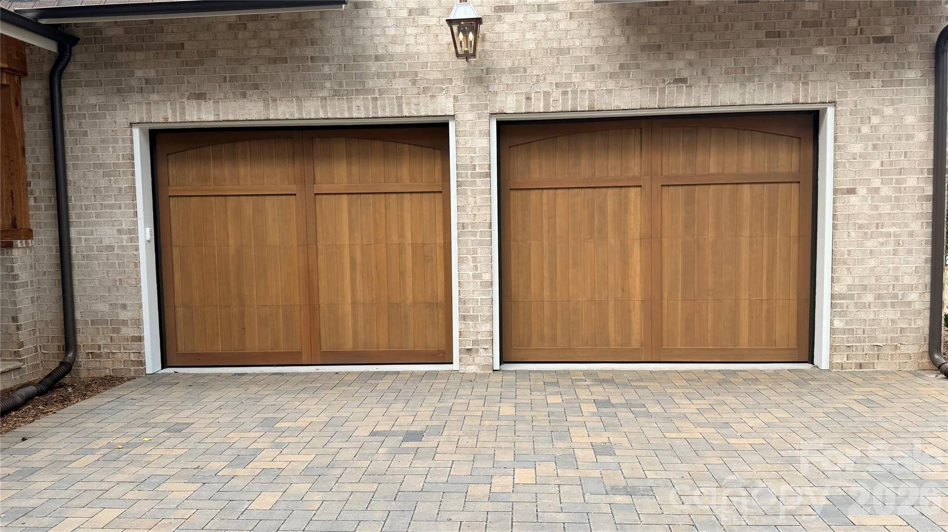 2+Car Attached Garage - (21'1"x33'3")- Both Wood doors are 10' wide