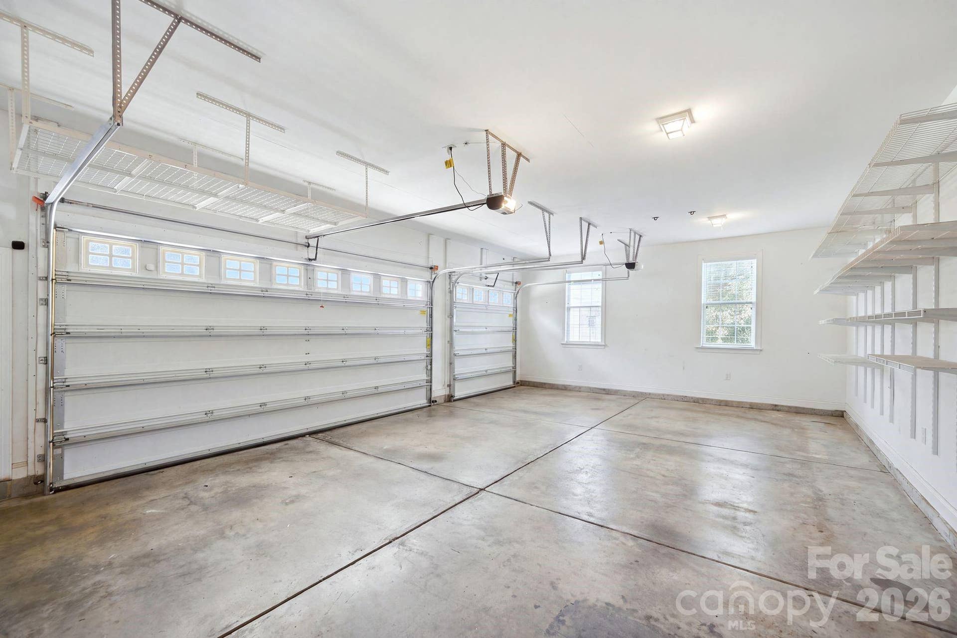 Massive three car side load garage