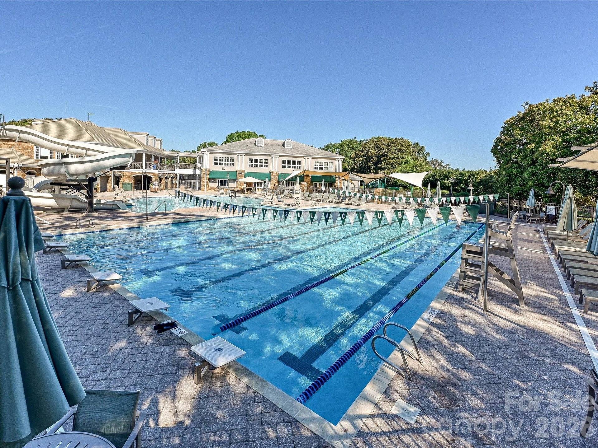 The Peninsula offers an exceptional amenity experience with championship golf, resort-style pools, tennis and pickleball courts, clubhouse facilities, and a scenic setting along Lake Norman.