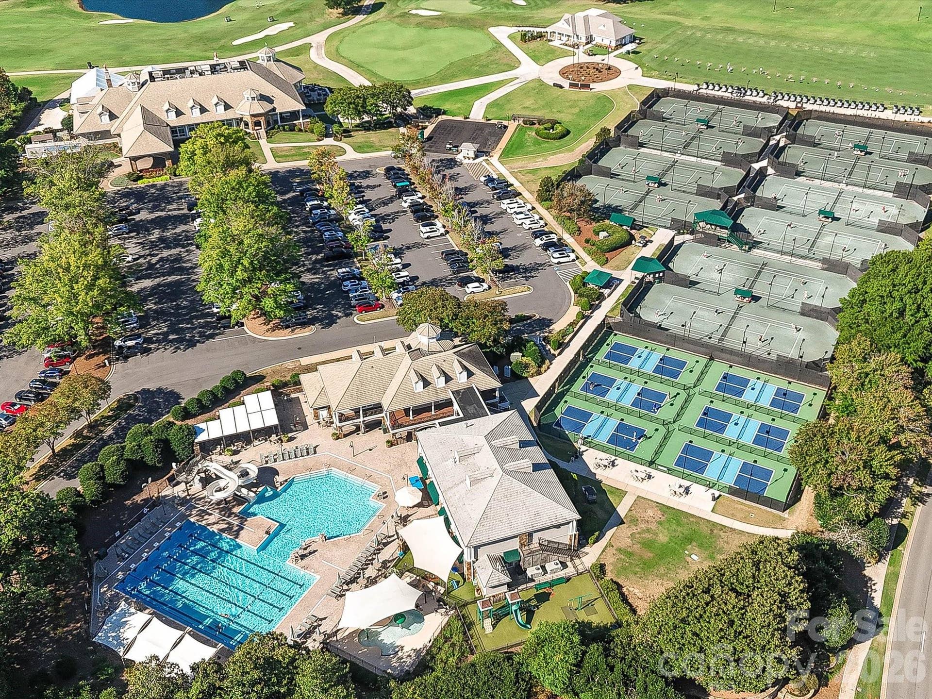The Peninsula offers an exceptional amenity experience with championship golf, resort-style pools, tennis and pickleball courts, clubhouse facilities, and a scenic setting along Lake Norman.