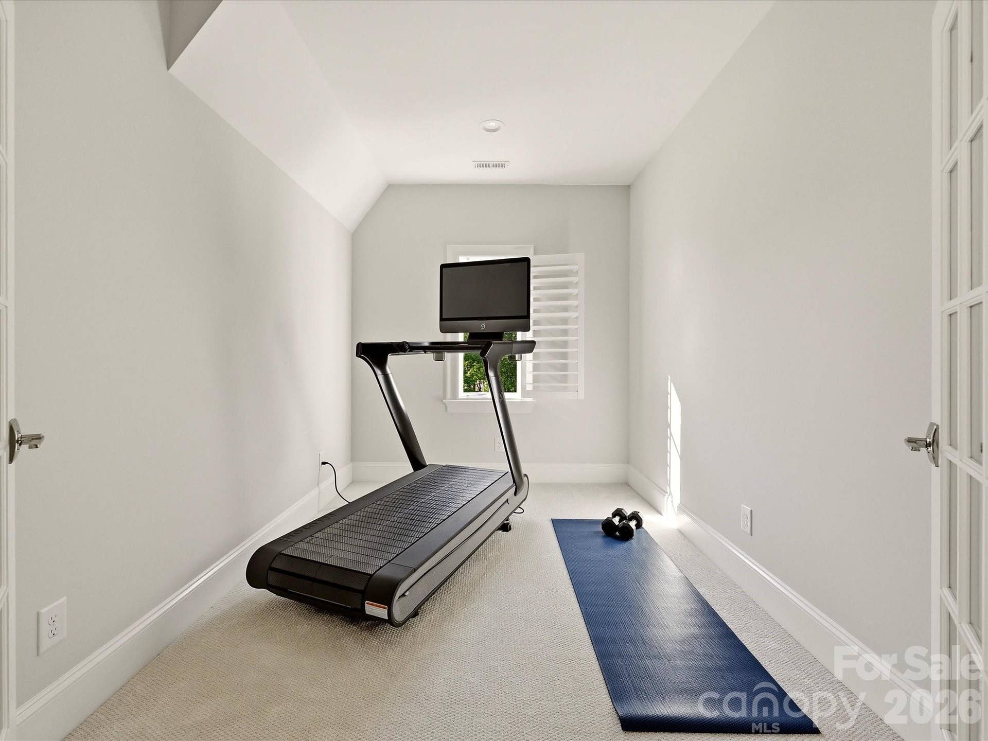 Versatile office/flex room offers a bright, private space ideal for a home office, fitness room, hobby area, or quiet retreat.