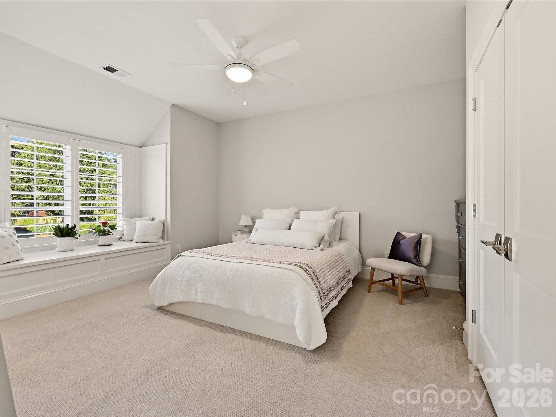 Bedroom 4 offers a spacious, light-filled retreat with soft neutral finishes, a charming window seat, and ample room for comfortable furnishings.
