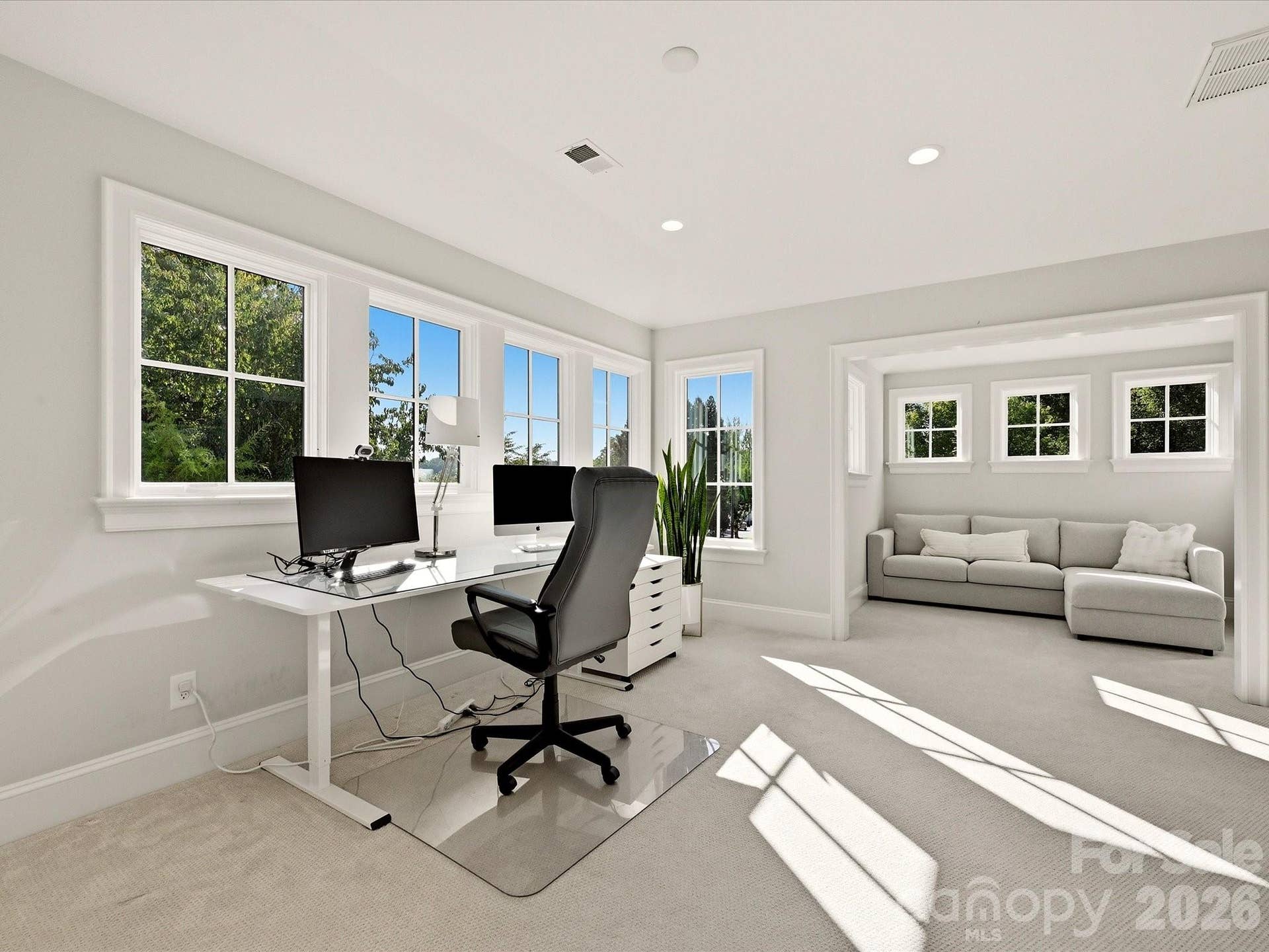 Bright and spacious bonus/office offers abundant natural light and a flexible layout with room for both a dedicated workspace and comfortable sitting area.