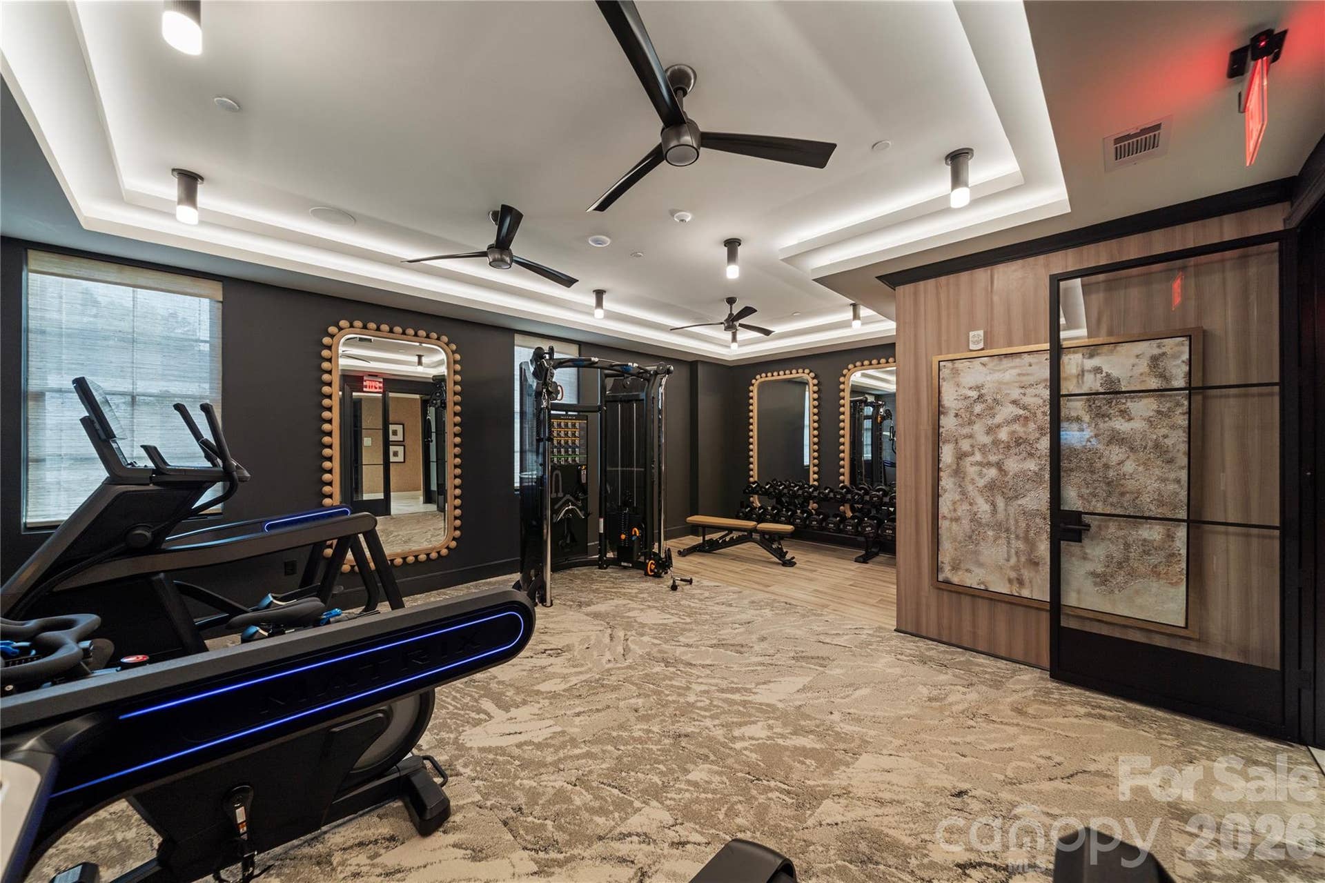 409 Queens Road, #503, Charlotte, NC 28207 The residents club includes this well-equipped private fitness center; with cardio machines, free weights, strength-training equipment and a polished contemporary design. The perfect place to work up a sweat before retiring to your spectacular 5th floor penthouse.
