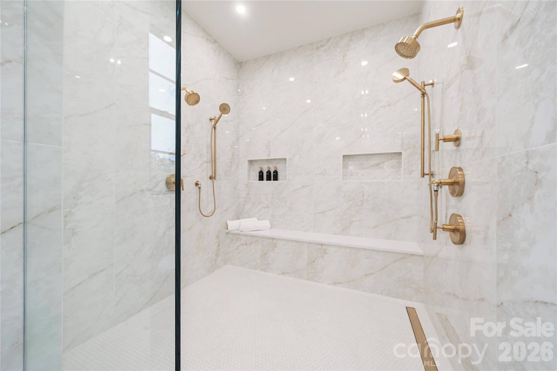 409 Queens Road, #503, Charlotte, NC 28207 The oversized primary shower is marble, with dual shower systems, for your daily spa experience.